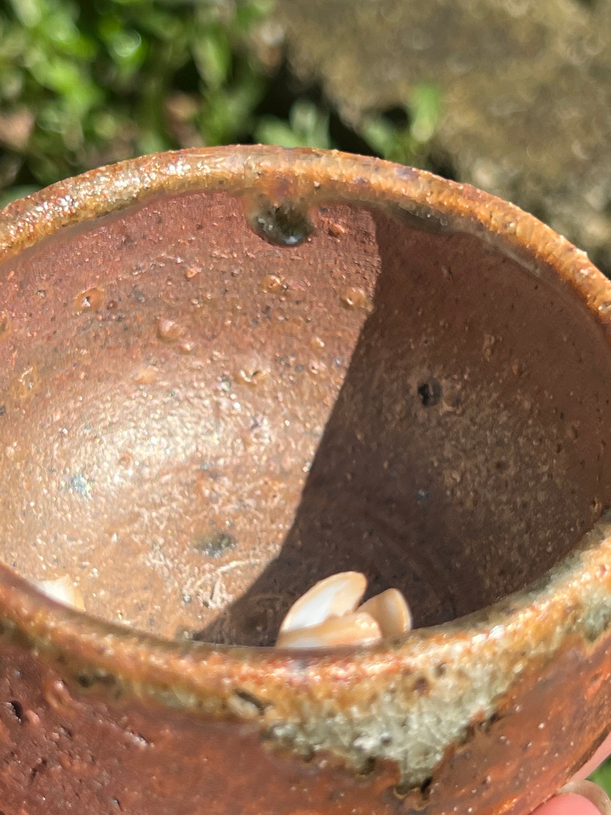 This is a woodfired pottery flower teacup