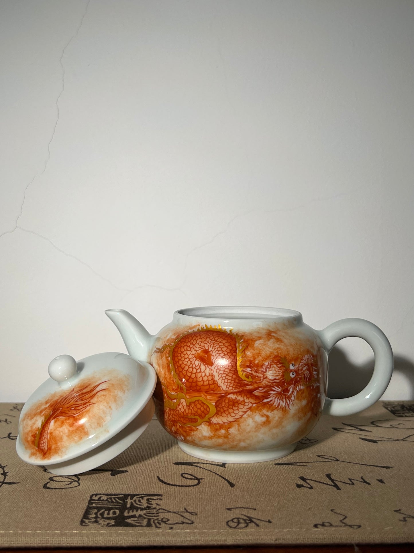 this is a Chinese Jingdezhen alum red dragon phoenix teapot.this is a ceramic teapot