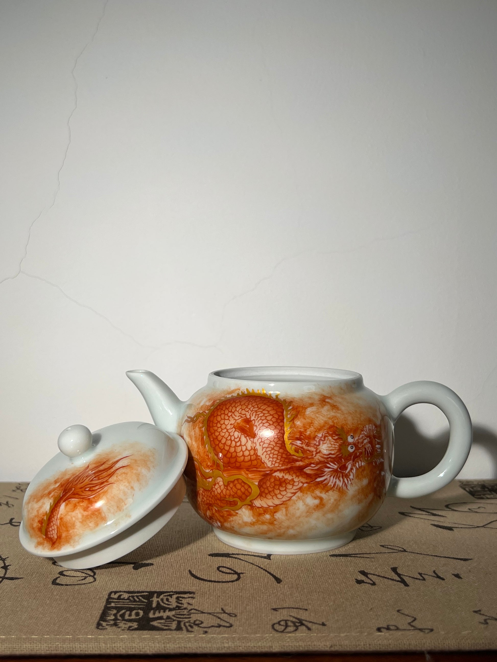 this is a Chinese Jingdezhen alum red dragon phoenix teapot.this is a ceramic teapot