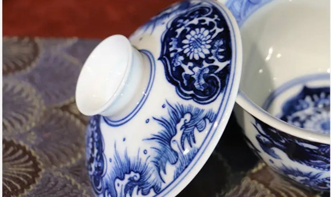 This is a Chinese Jingdezhen blue and white porcelain dragon teapot gaiwan