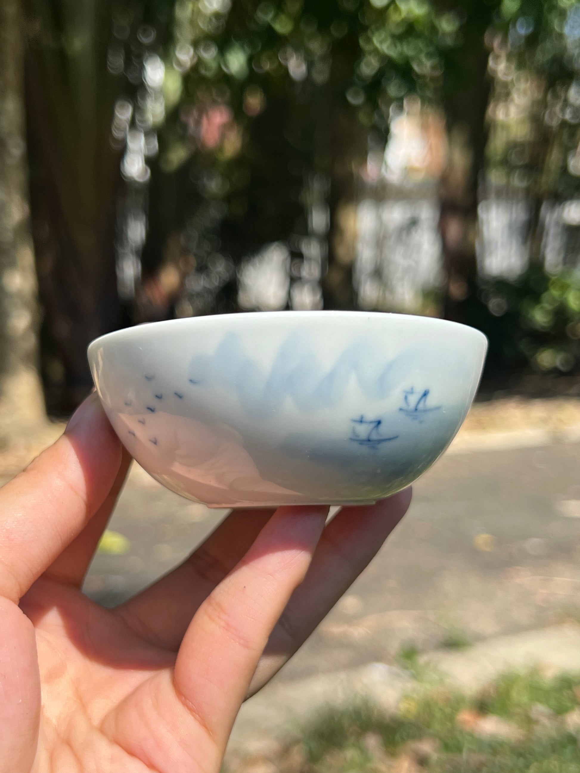 This is a Chinese Jingdezhen blue and white porcelain landscape teacup