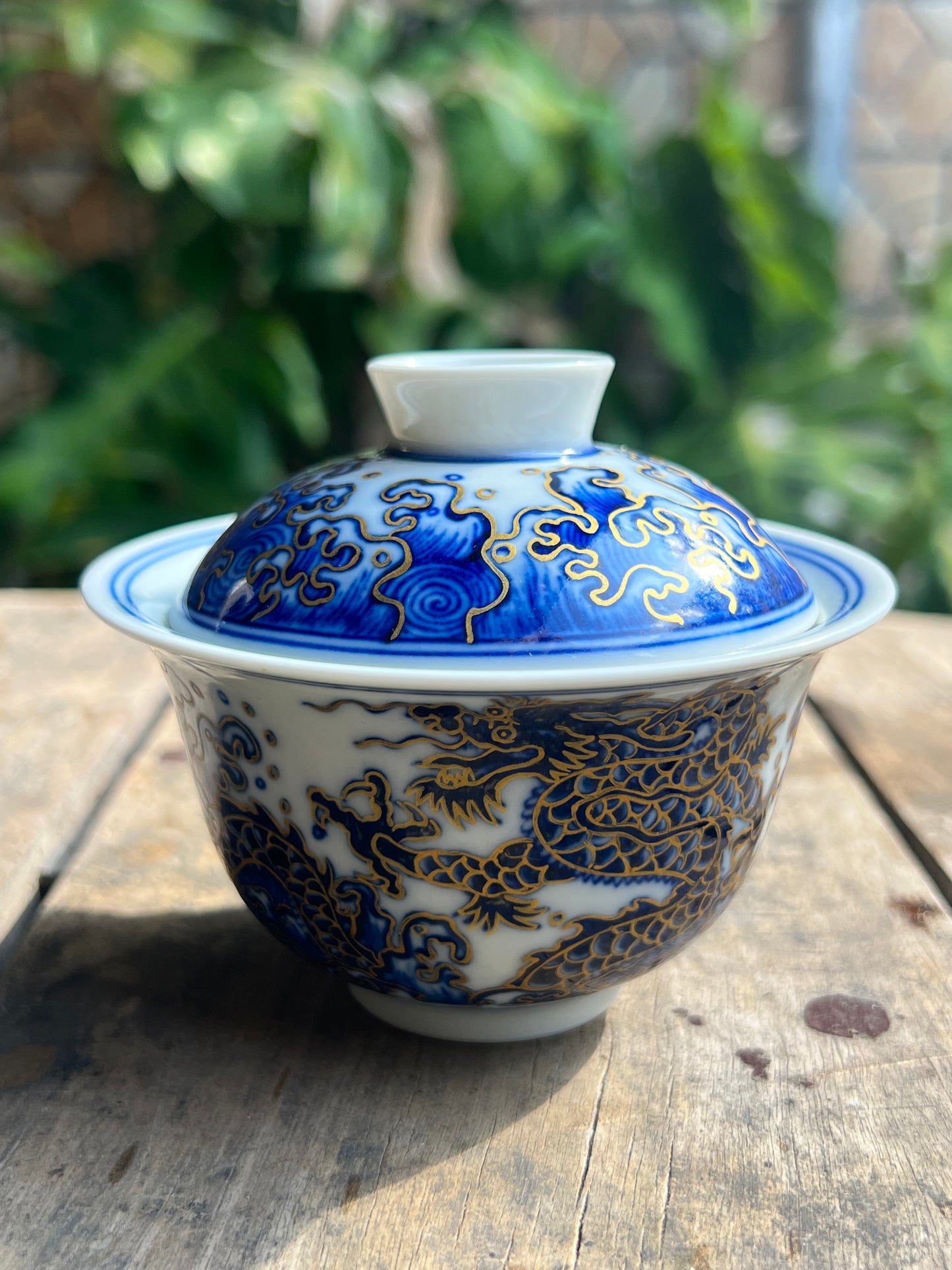 This is a Chinese Jingdezhen blue and white porcelain dragon teapot gaiwan