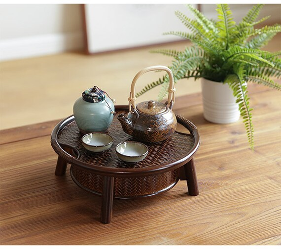 This is a bamboo weaving storage tea table.this is a black tea table 