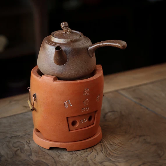 This is a pottery side handle kettle