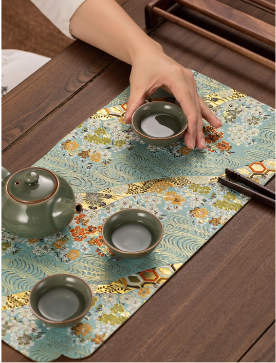 This is a silk brocade tea mat.this is a waterproof table cloth