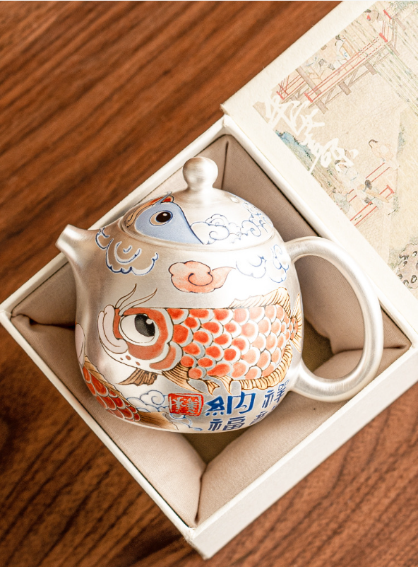  this is a gilded silver teapot. this is a ceramic teapot