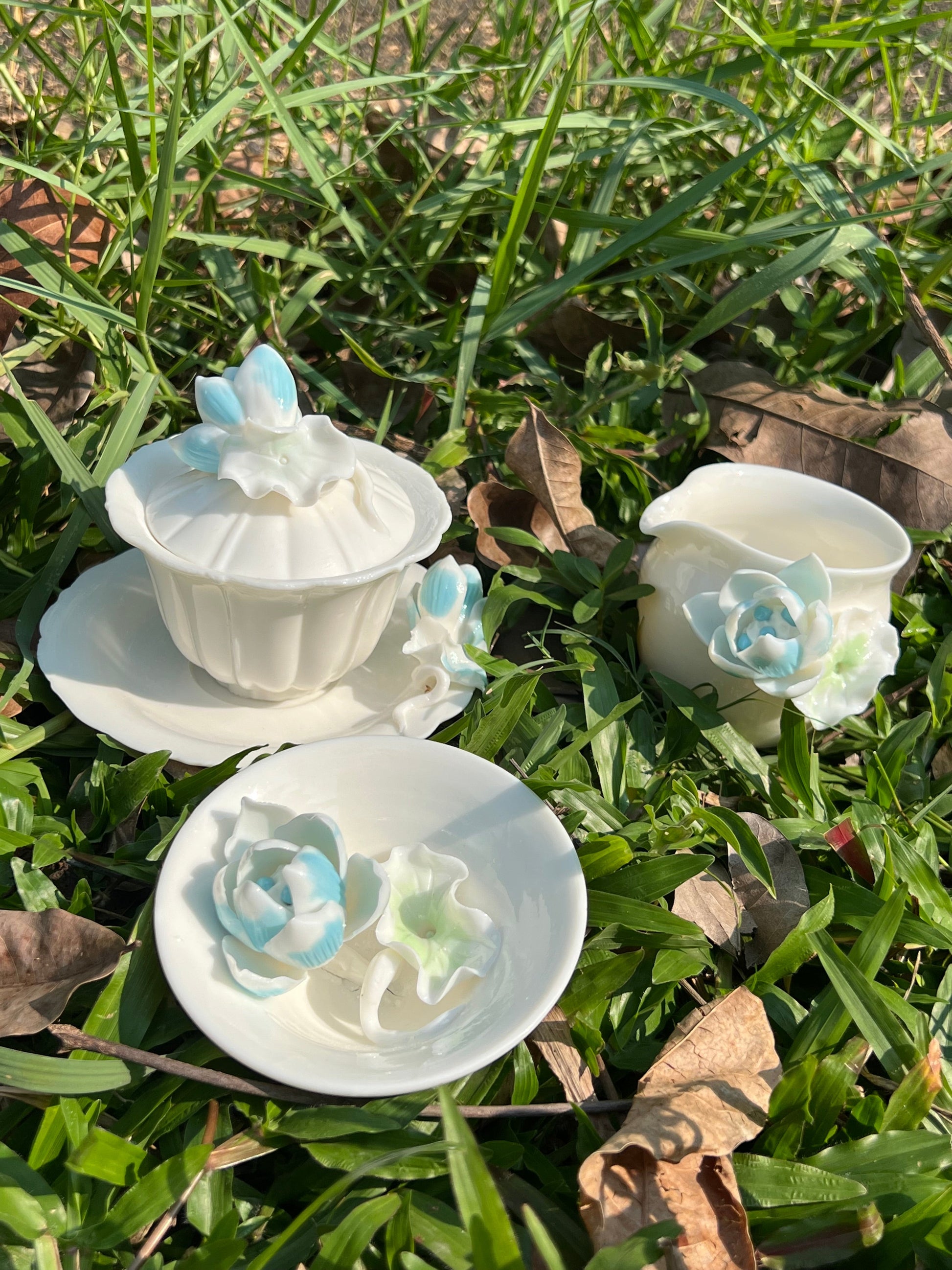 this is a woodfired white fine pottery flower teacup