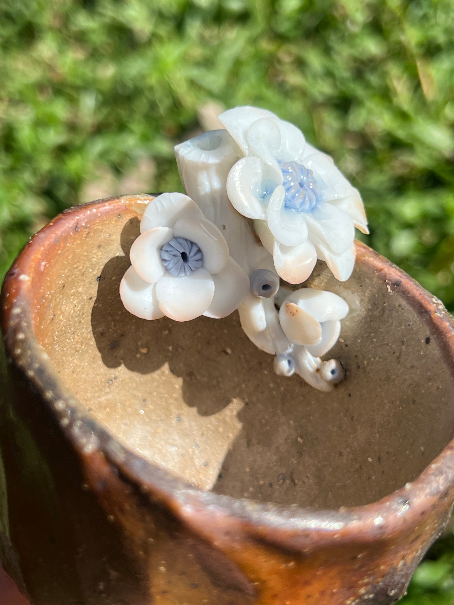 This is a woodfired pottery flower teacup