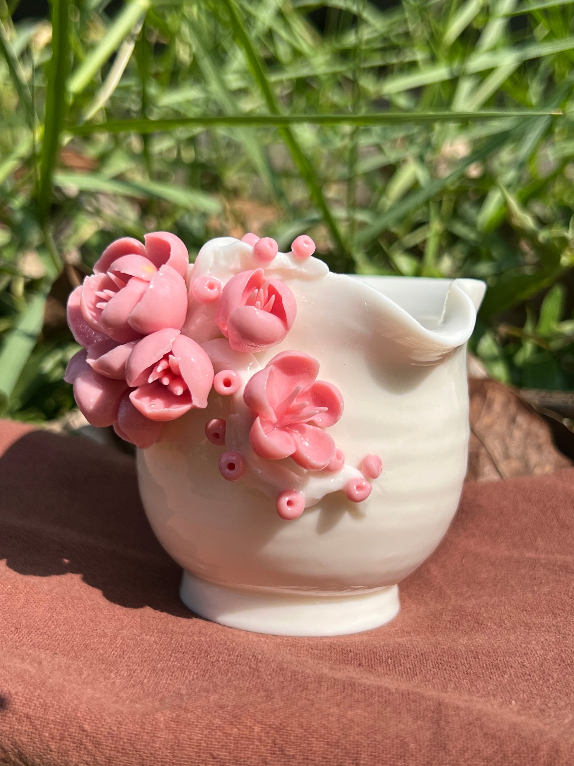 This is a woodfired white pottery flower faircup gongdaobei