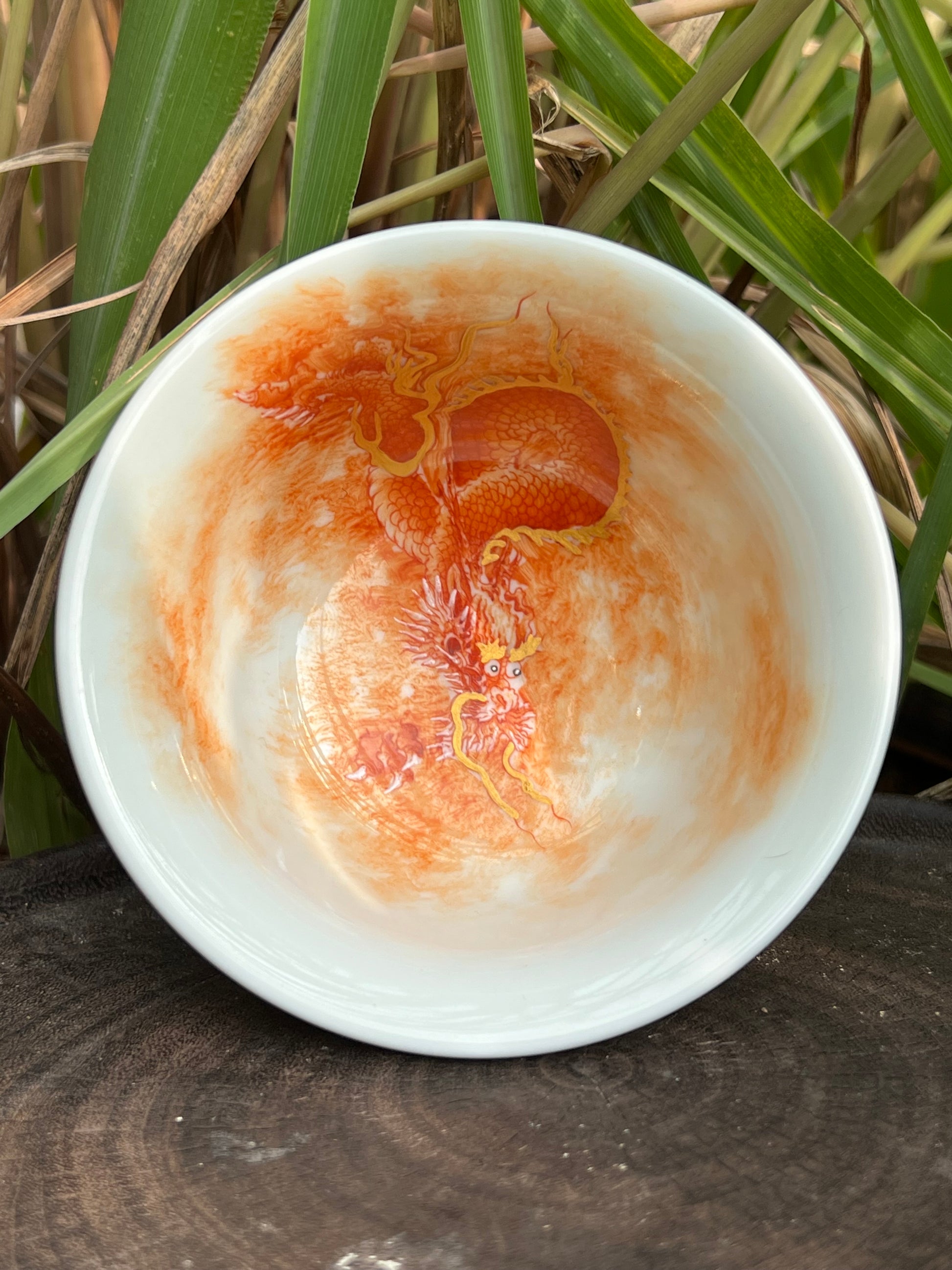 this is a Chinese Jingdezhen alum red dragon phoenix teacup. this is a ceramic teacup