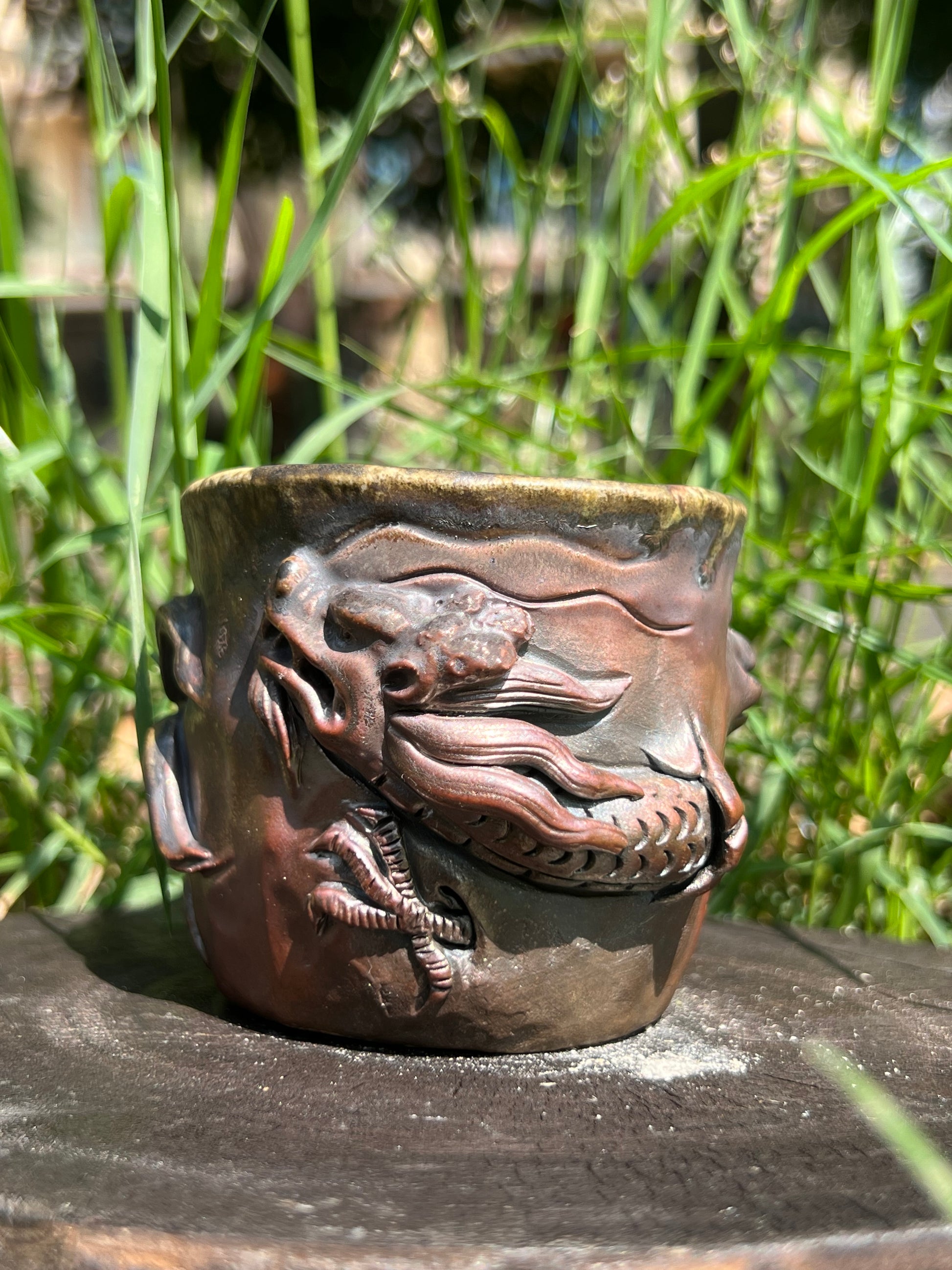 This is a woodfired tietai pottery dragon teacup