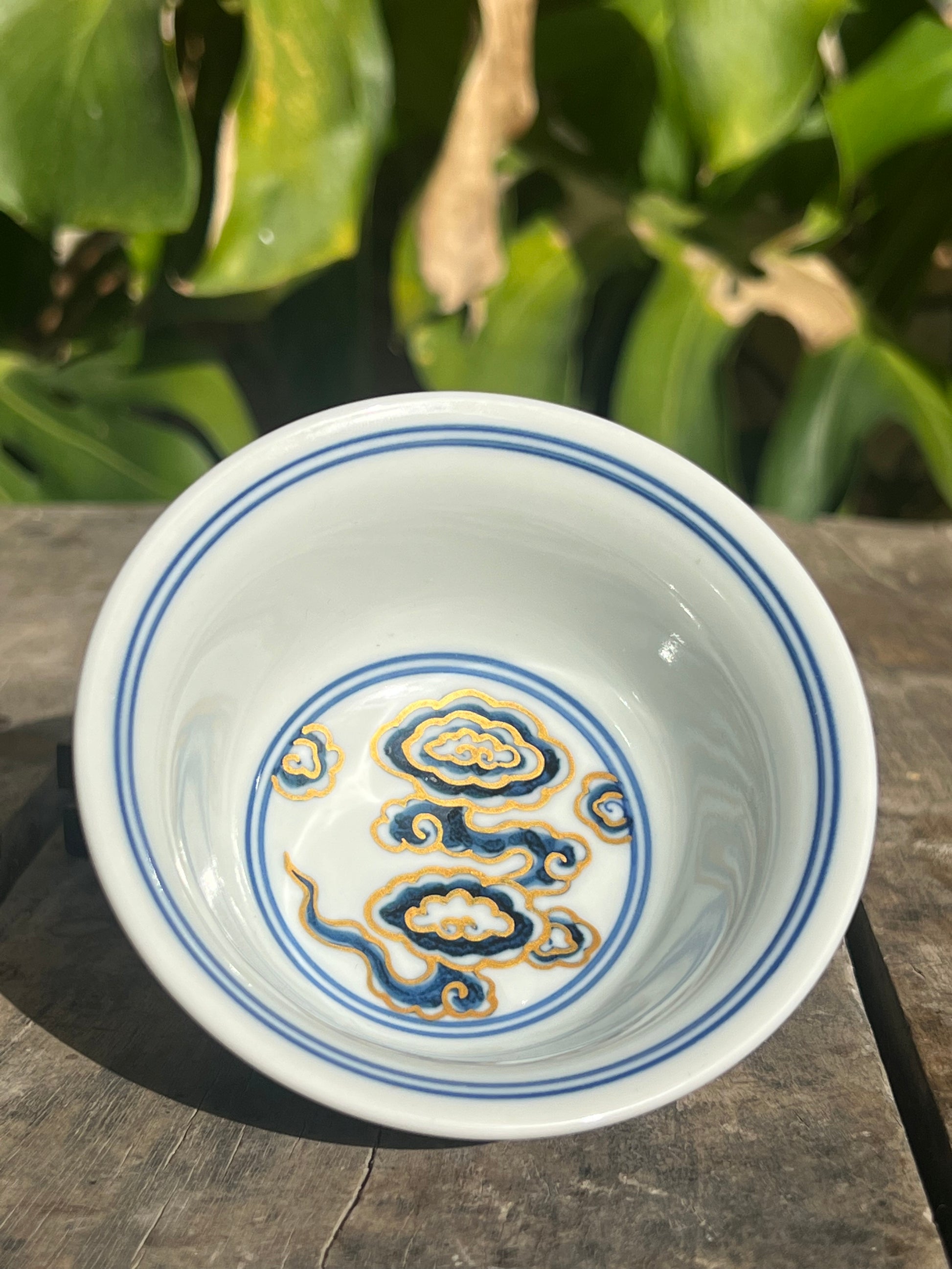 This is a Chinese Jingdezhen blue and white porcelain dragon tea cup