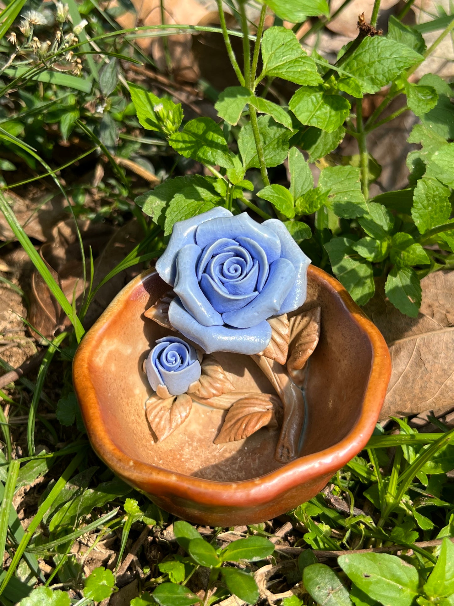 This is a woodfired pottery flower teacup