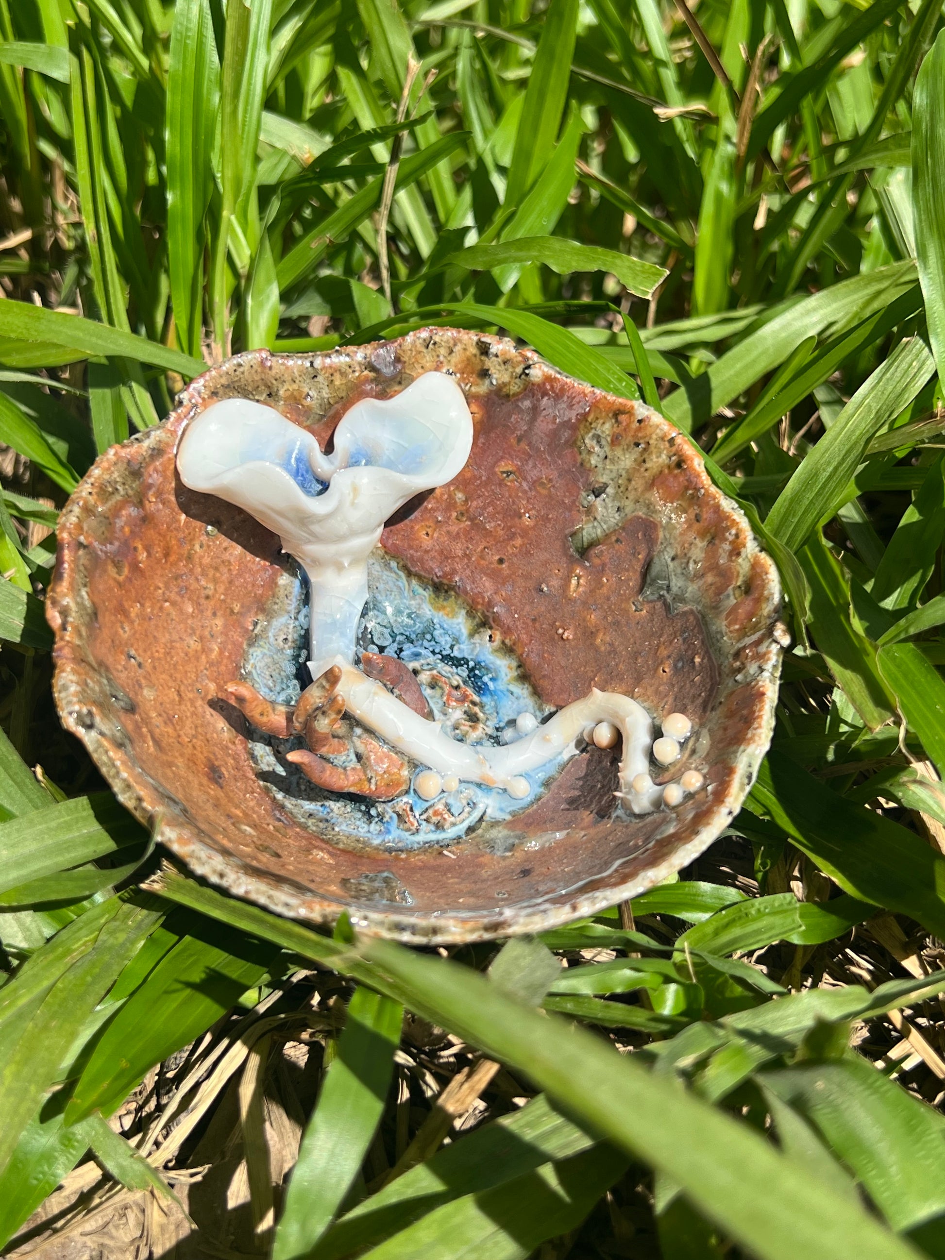 This is a woodfired pottery flower teacup