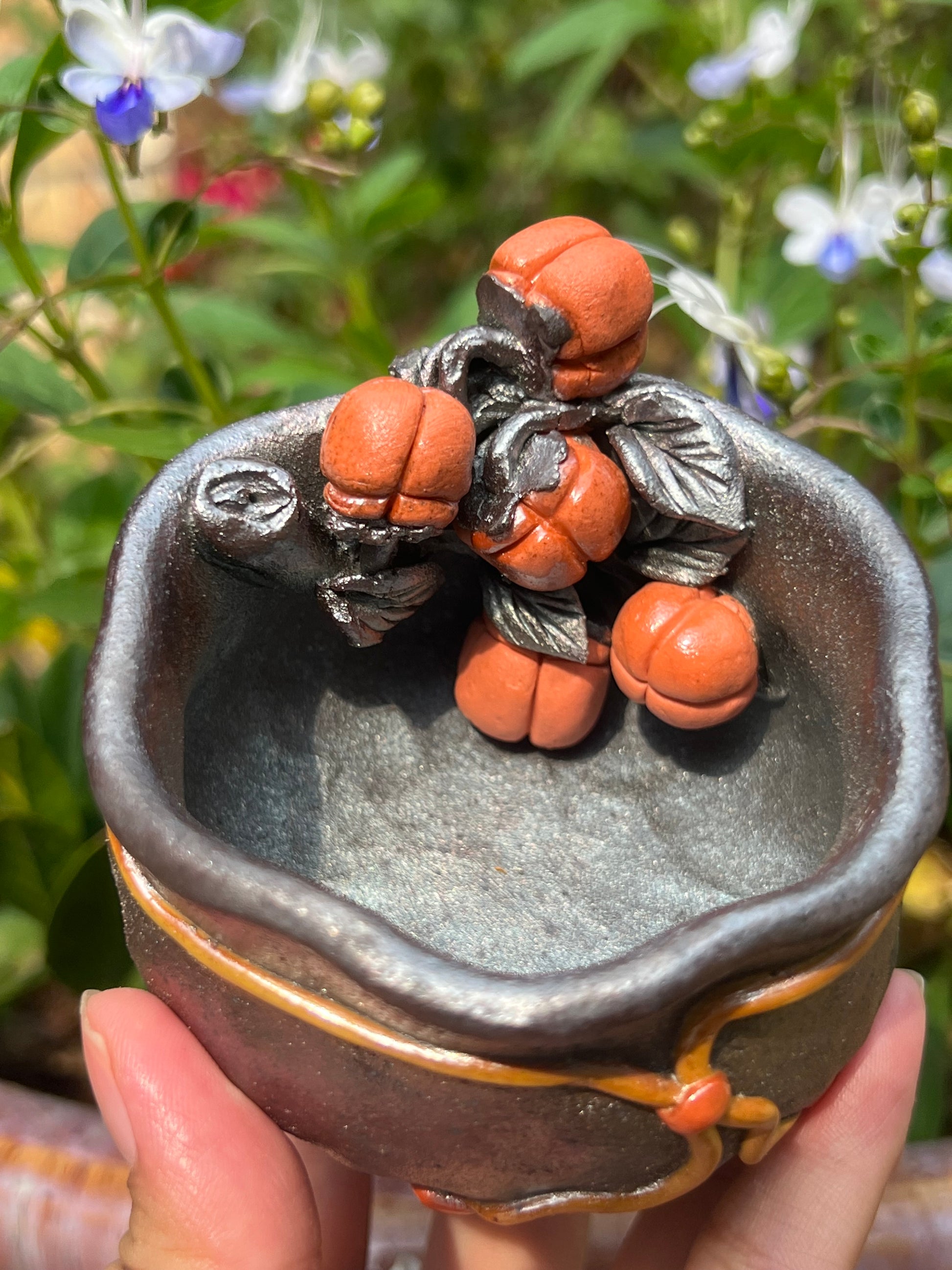 This is a woodfired tietai pottery flower teacup