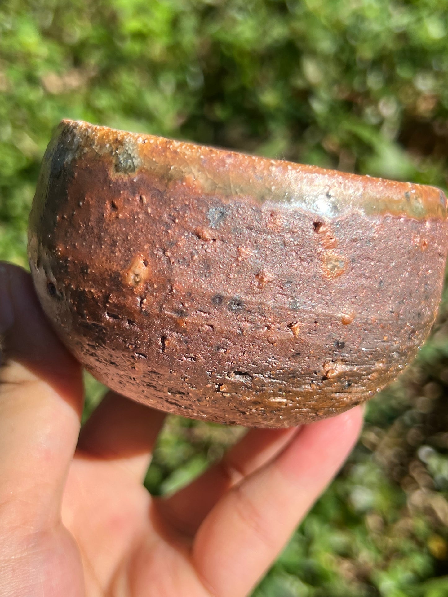 This is a woodfired pottery flower teacup