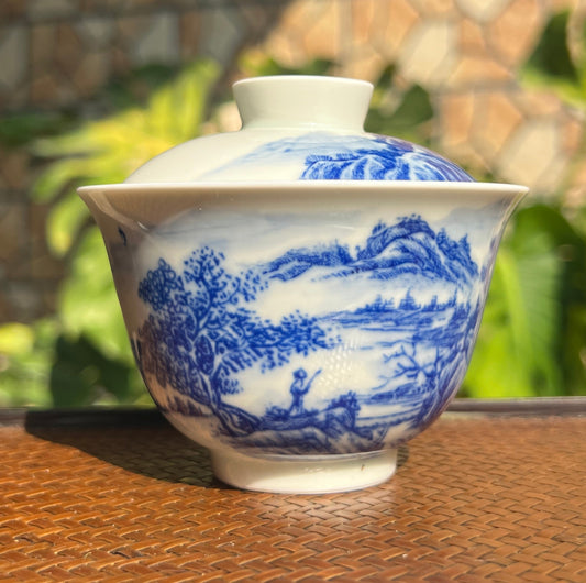 This is a Chinese Jingdezhen blue and white porcelain landscape teapot gaiwan