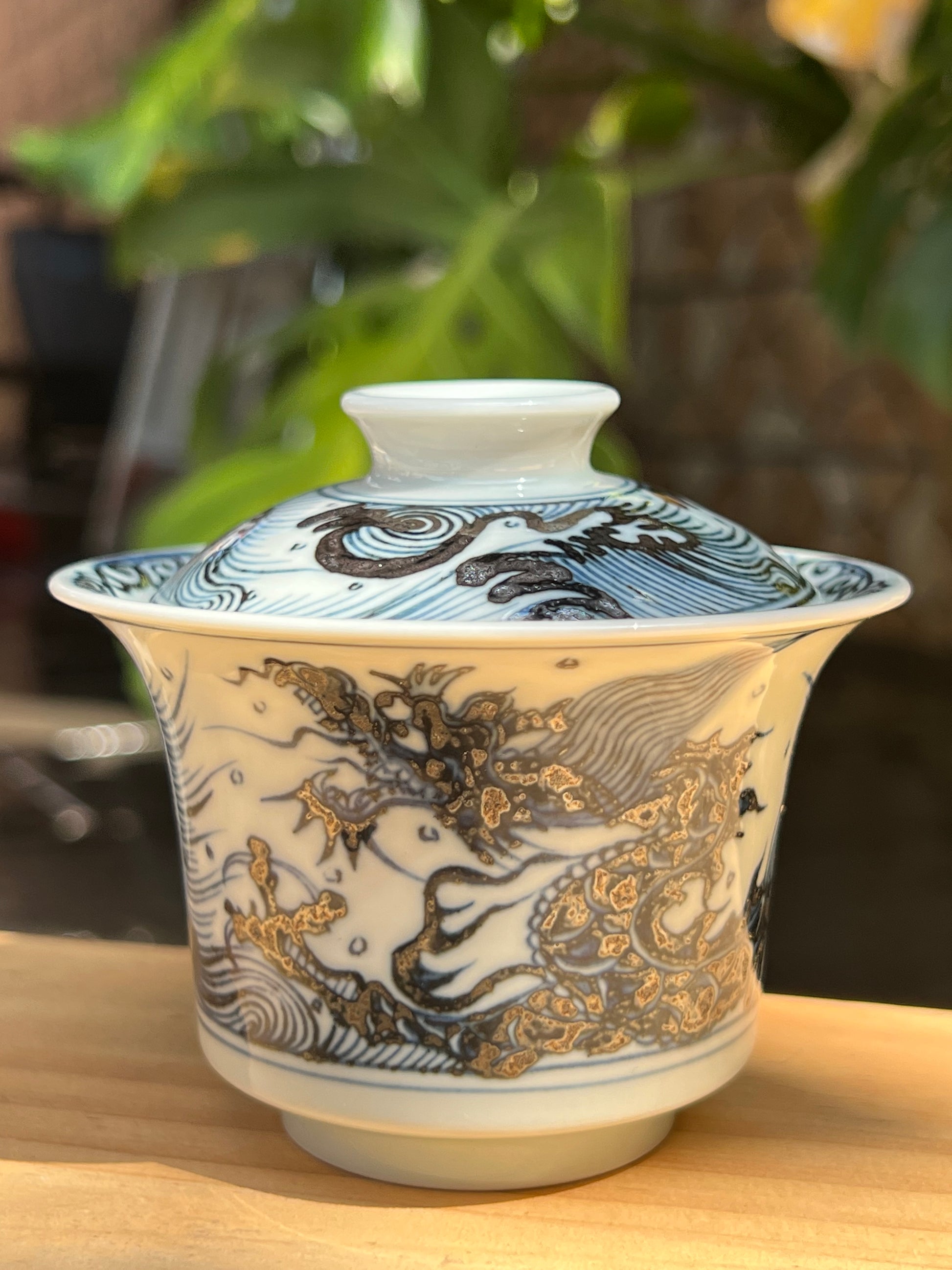 This is a Chinese Jingdezhen blue and white porcelain dragon teapot gaiwan