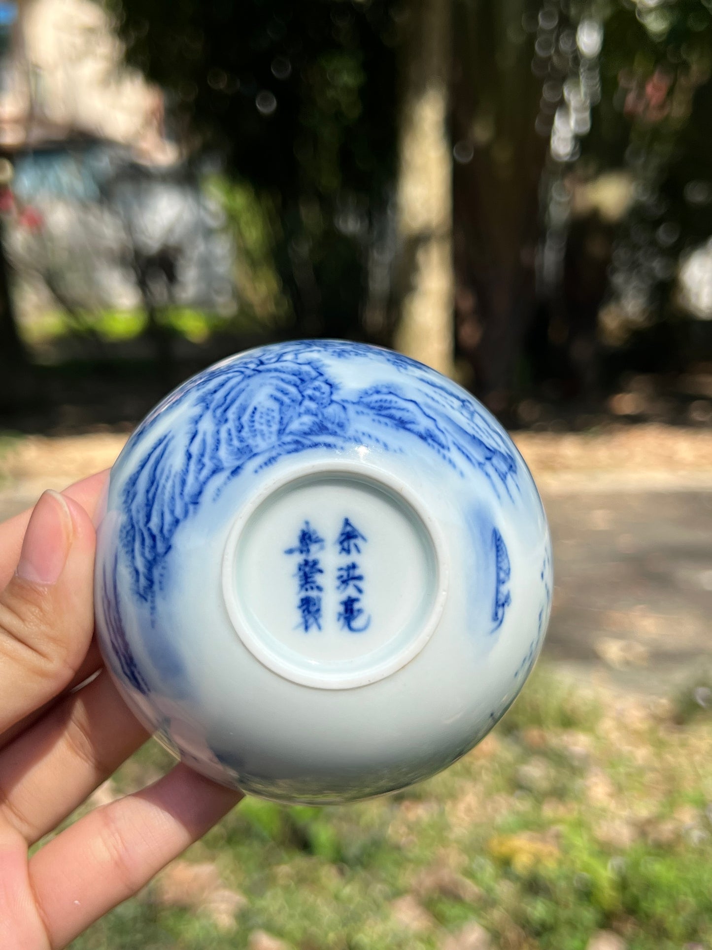 This is a Chinese Jingdezhen blue and white porcelain landscape teacup