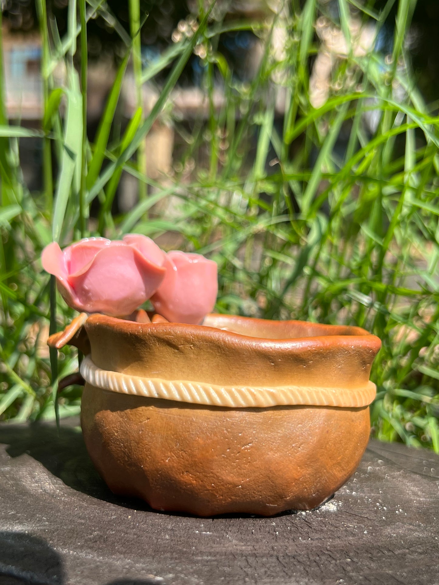 This is a woodfired pottery flower teacup