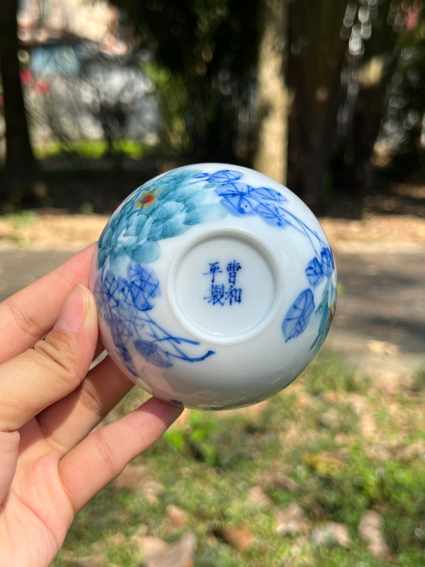 This is a Chinese Jingdezhen blue and white porcelain peony flower teacup