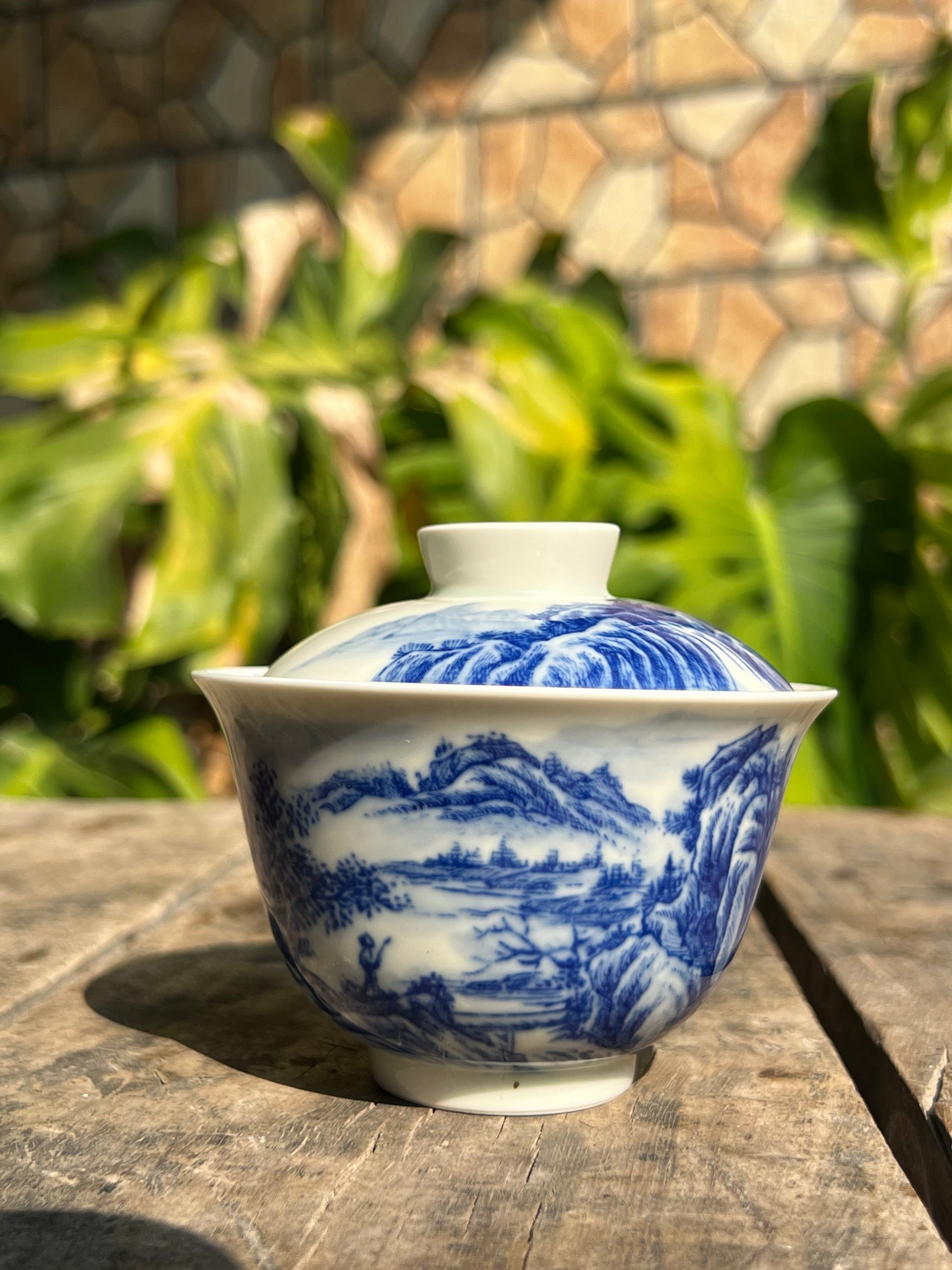 This is a Chinese Jingdezhen blue and white porcelain landscape teapot gaiwan