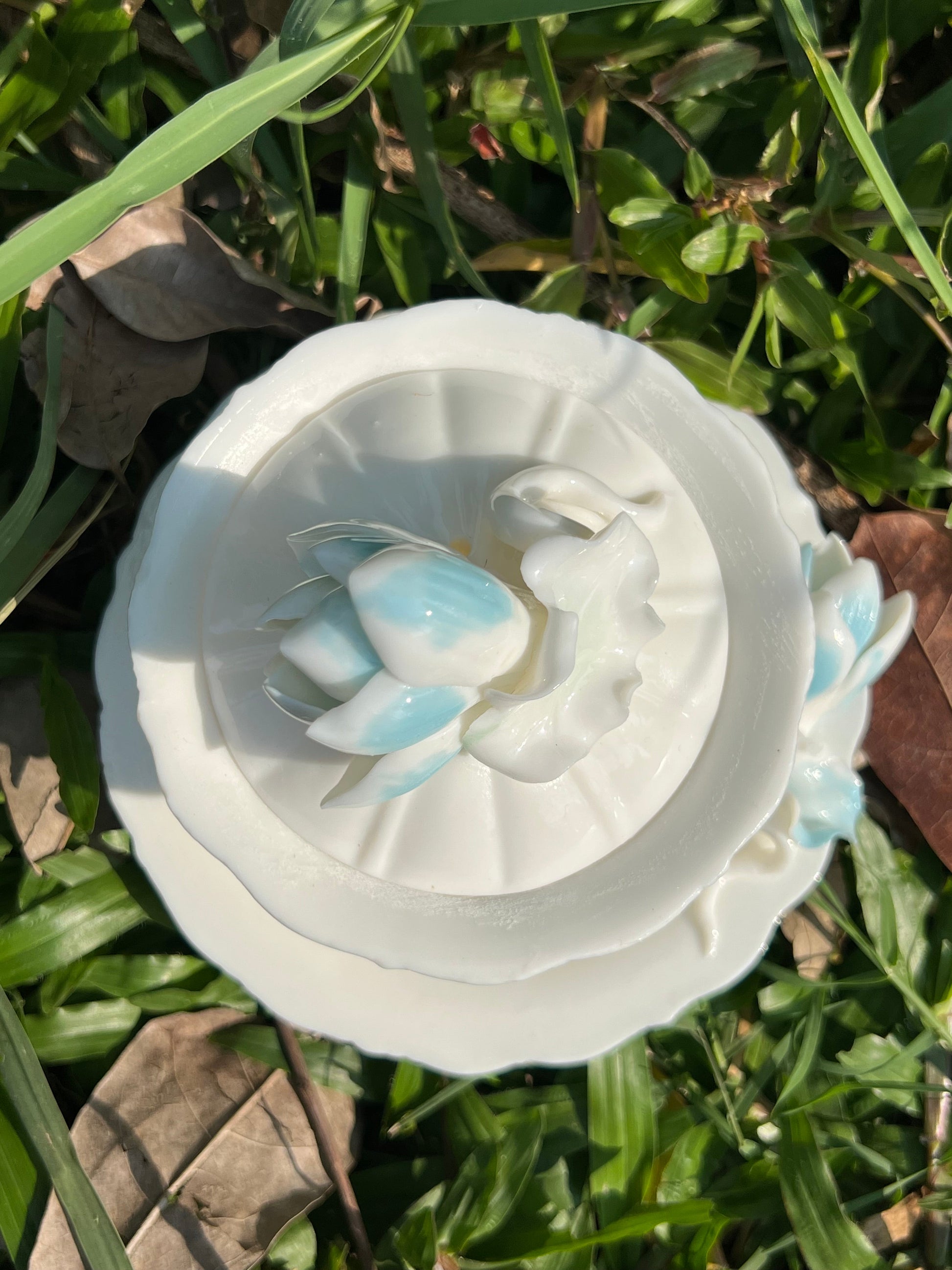 this is a woodfired white fine pottery flower teacup