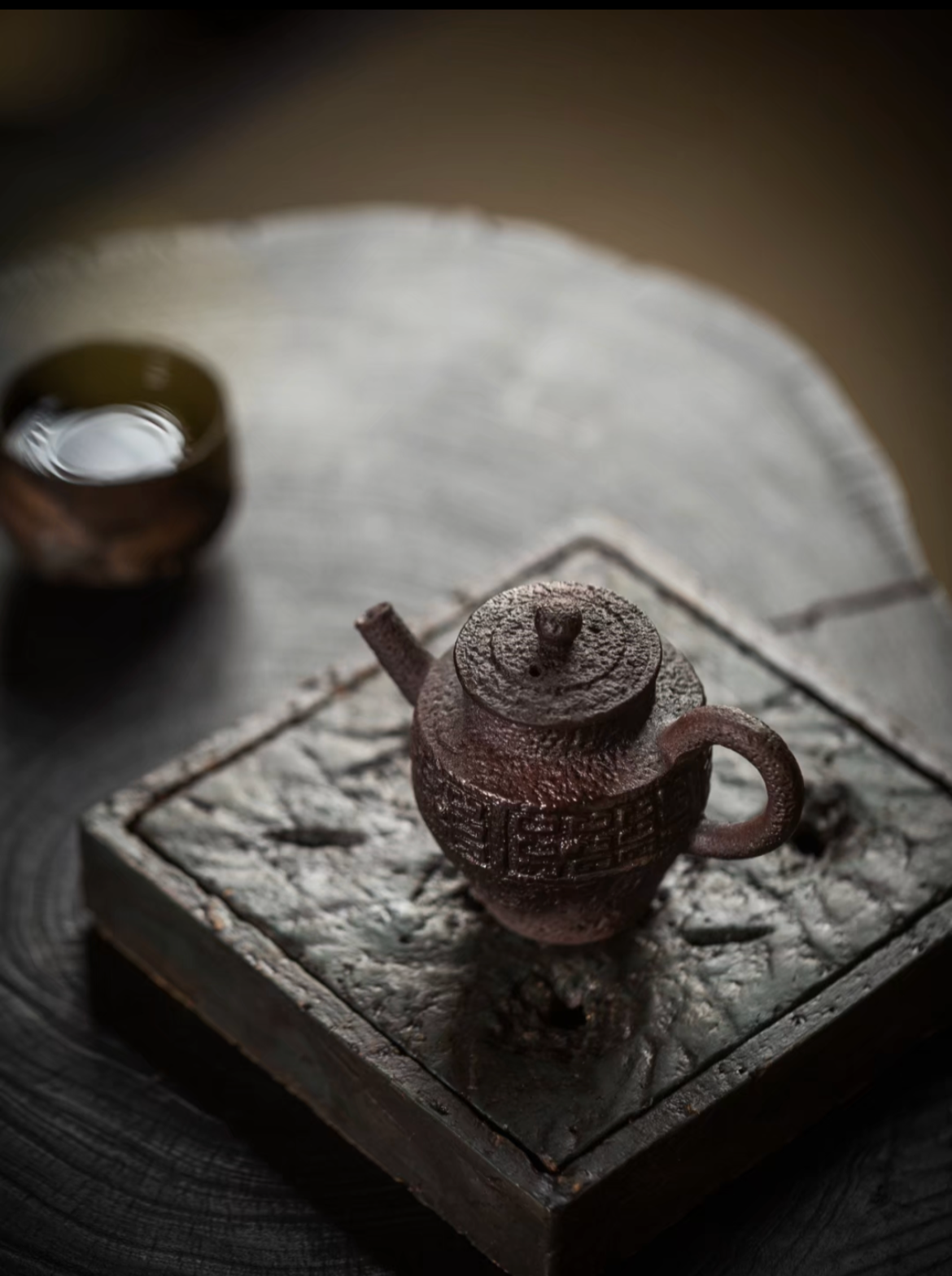 this is a pottery teapot. this is a purple clay teapot