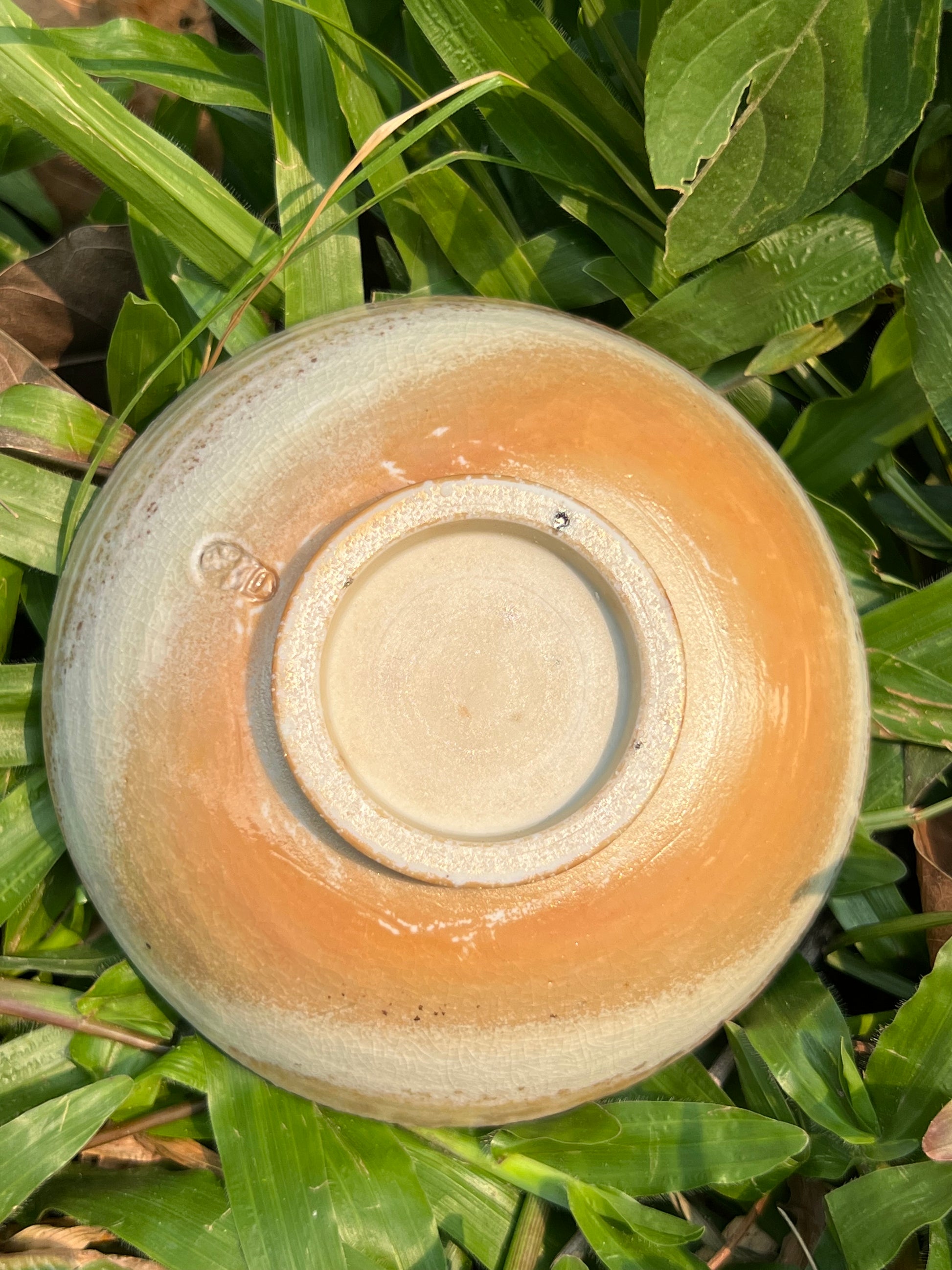 This is a woodfired pottery flower teacup