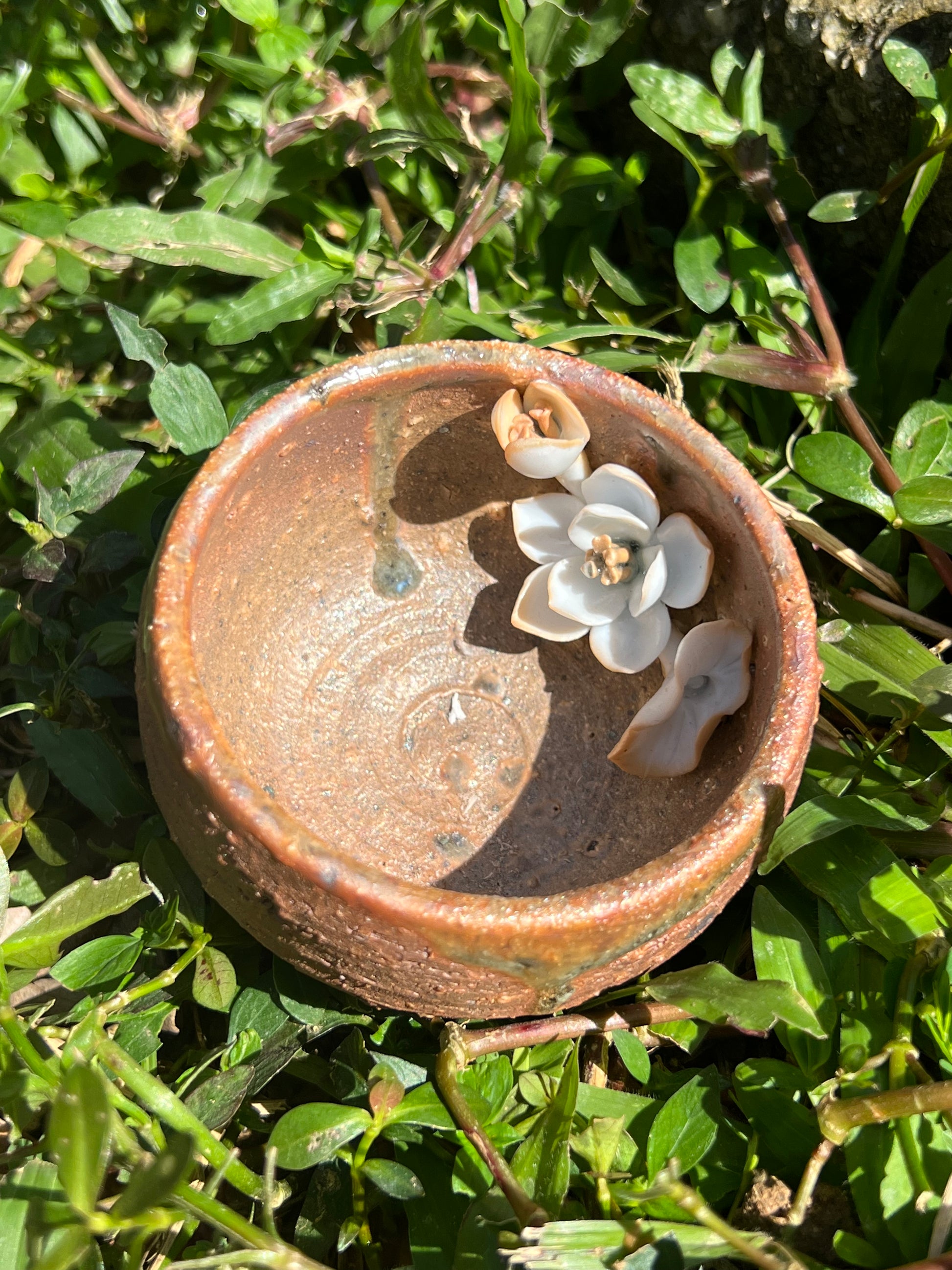 This is a woodfired pottery flower teacup