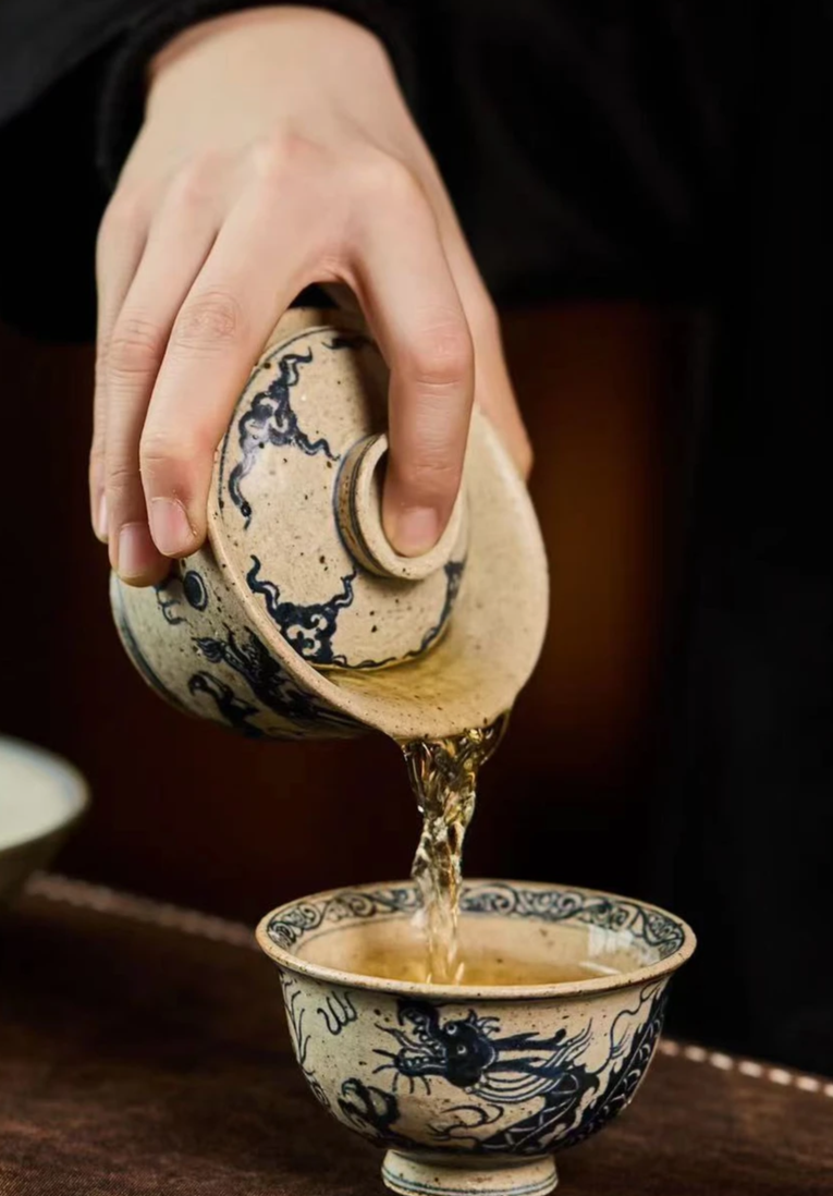 This is a Chinese Jingdezhen blue and white pottery dragon teapot gaiwan