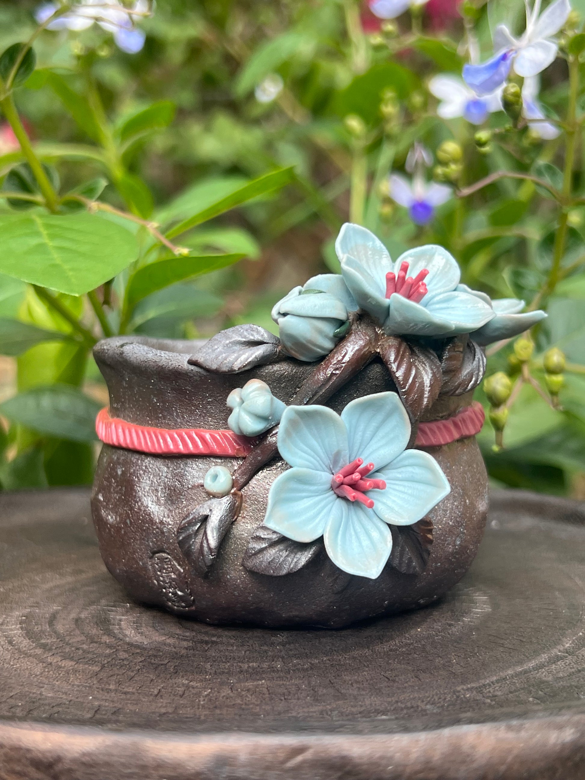 This is a woodfired tietai pottery flower teacup