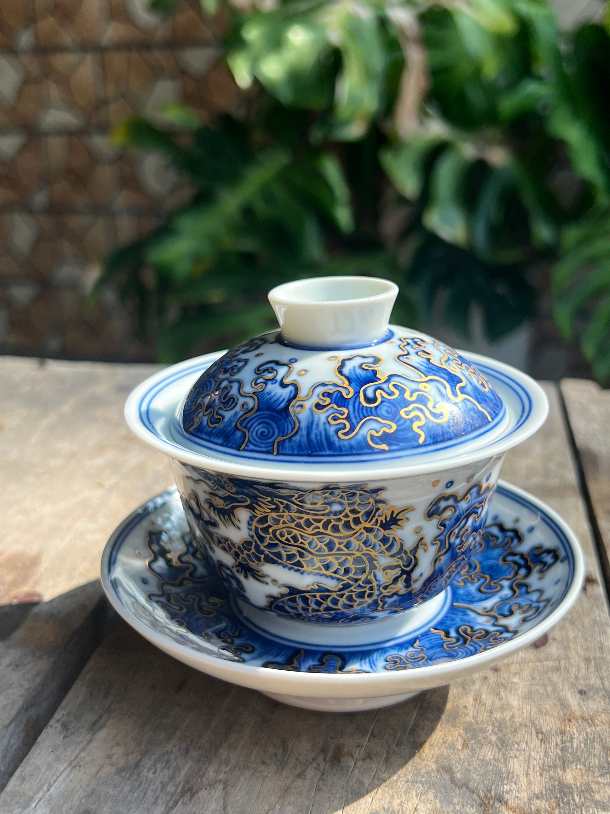 This is a Chinese Jingdezhen blue and white porcelain dragon teapot gaiwan