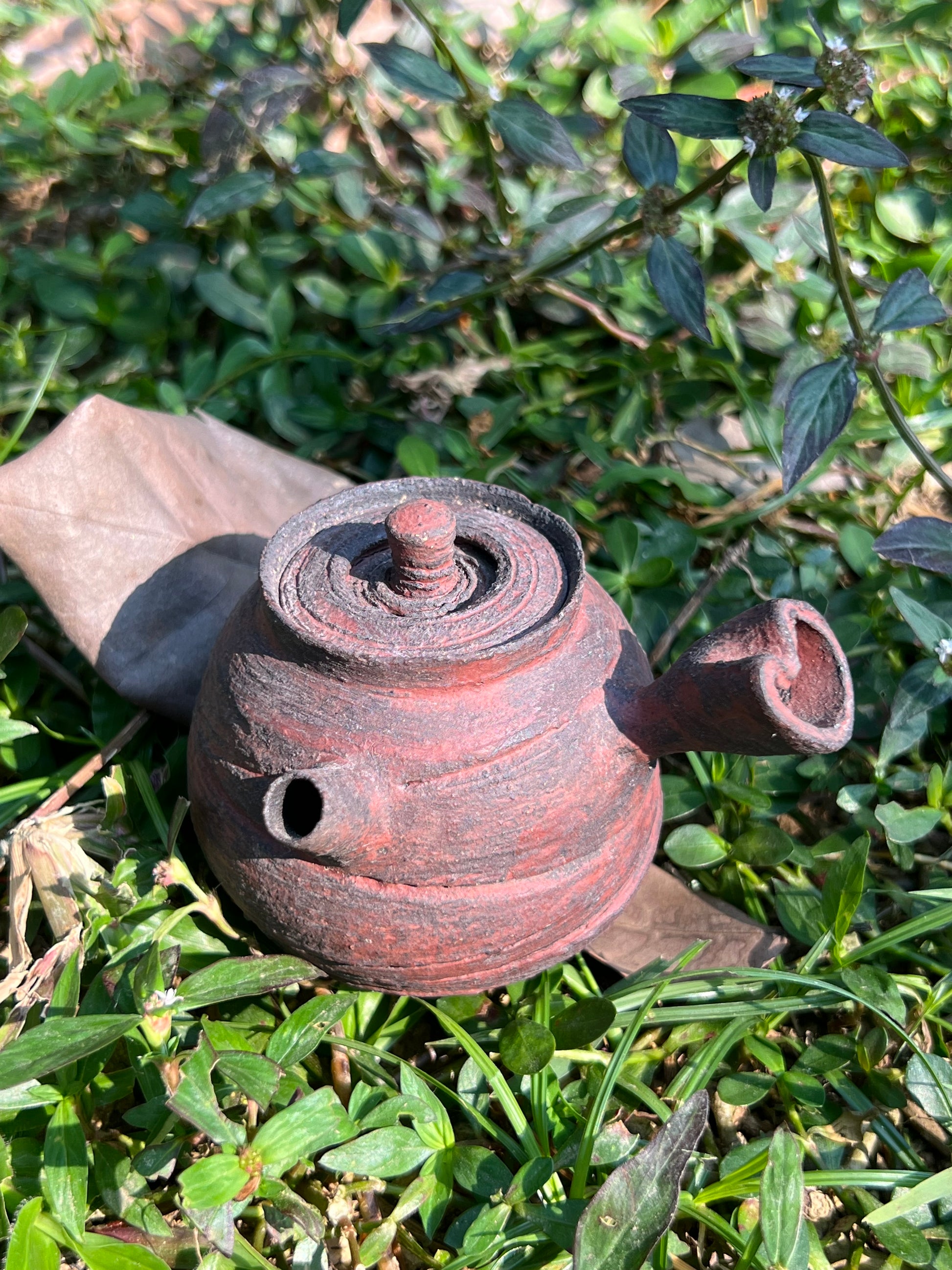 This is a pottery teapot