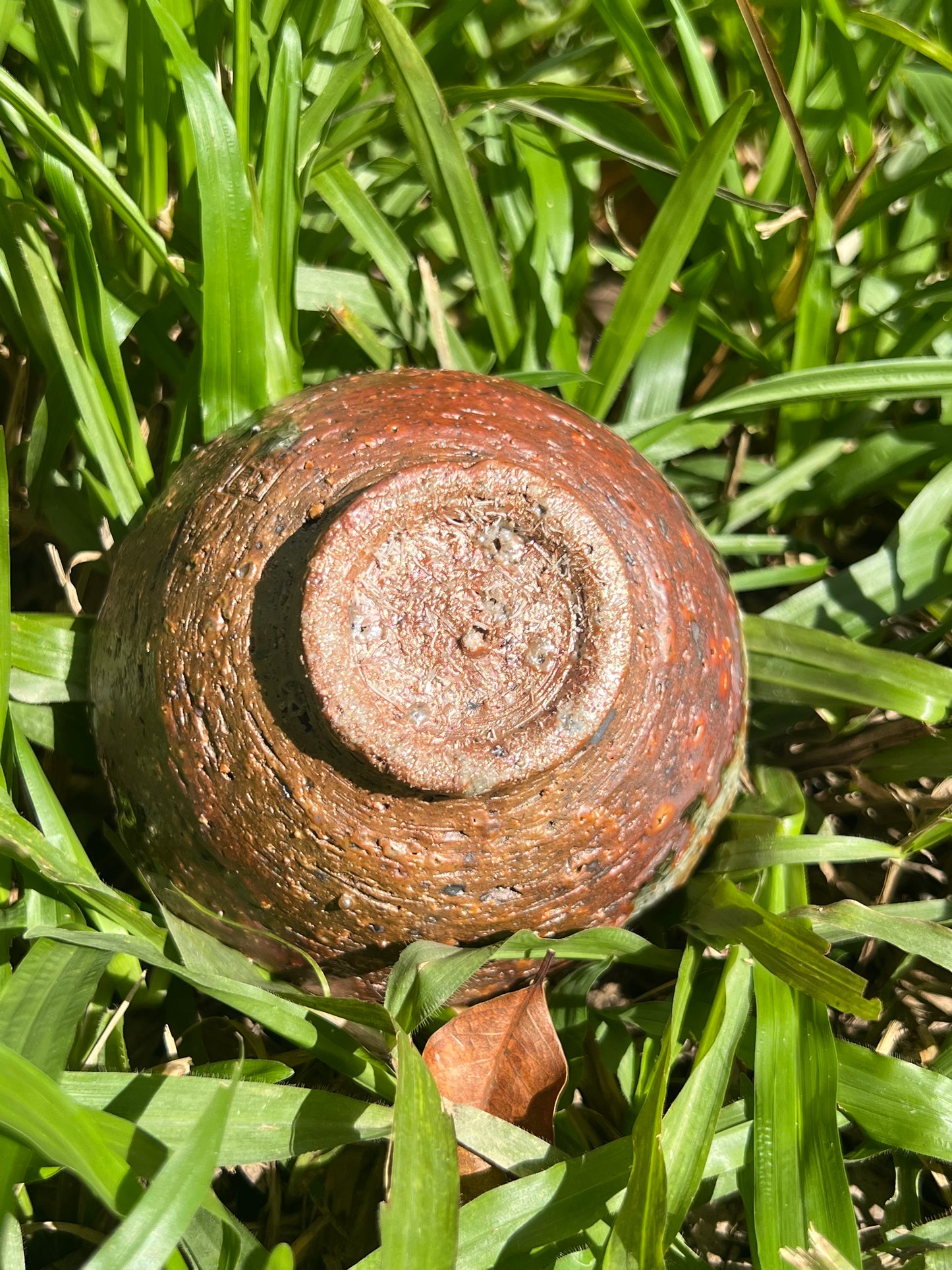 This is a woodfired pottery flower teacup