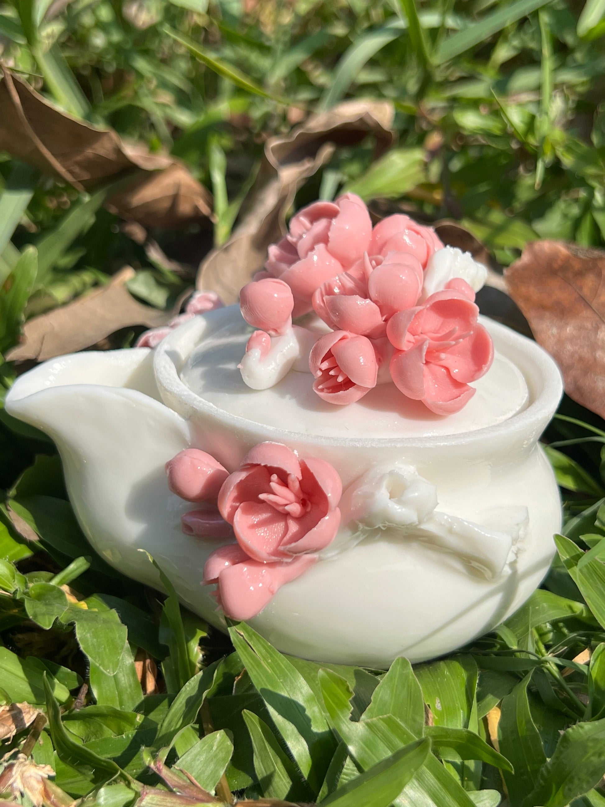 this is a woodfired white fine pottery flower teacup