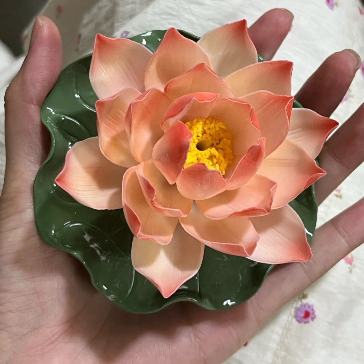 This is a ceramic lotus incense holder