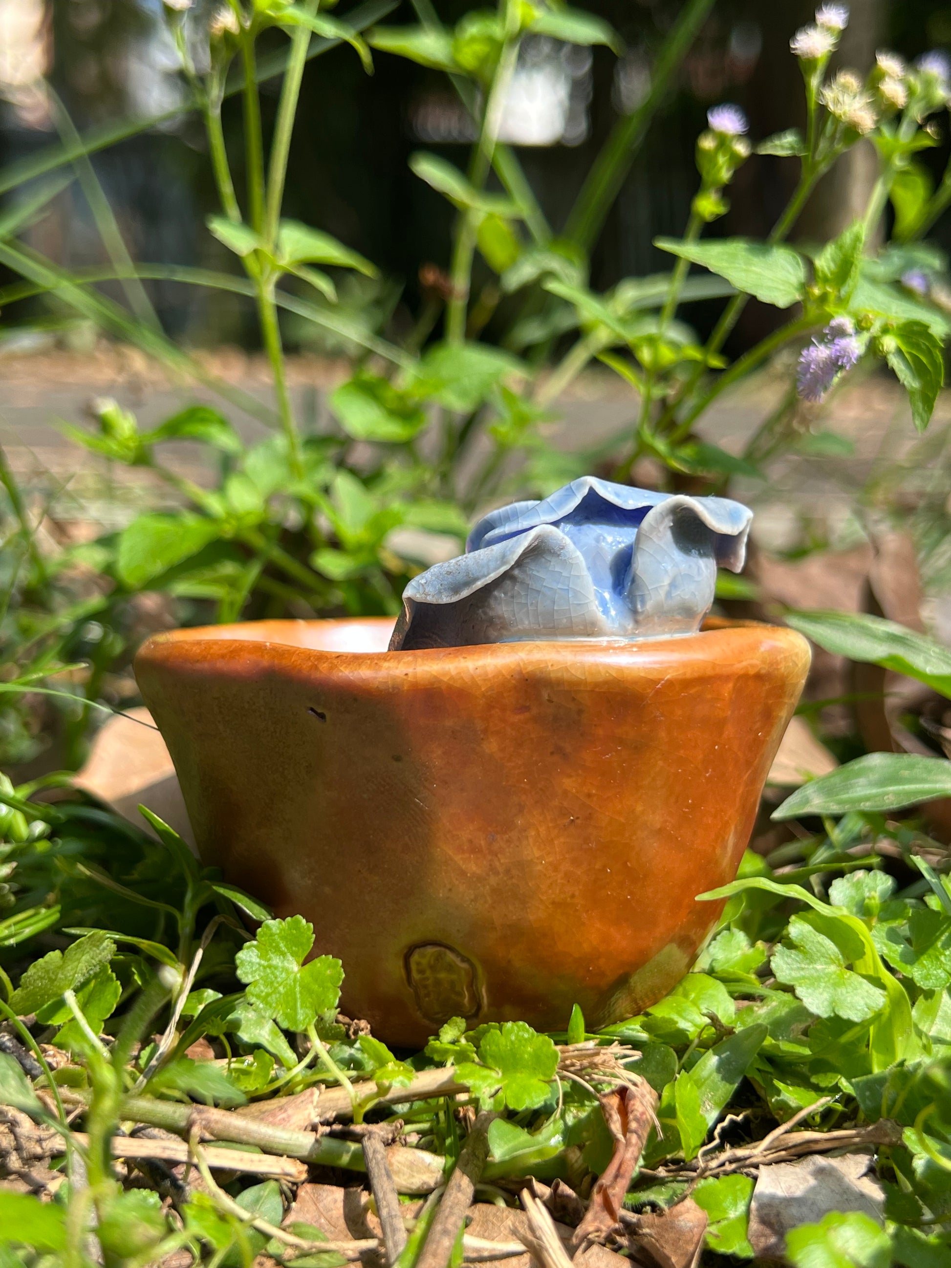 This is a woodfired pottery flower teacup