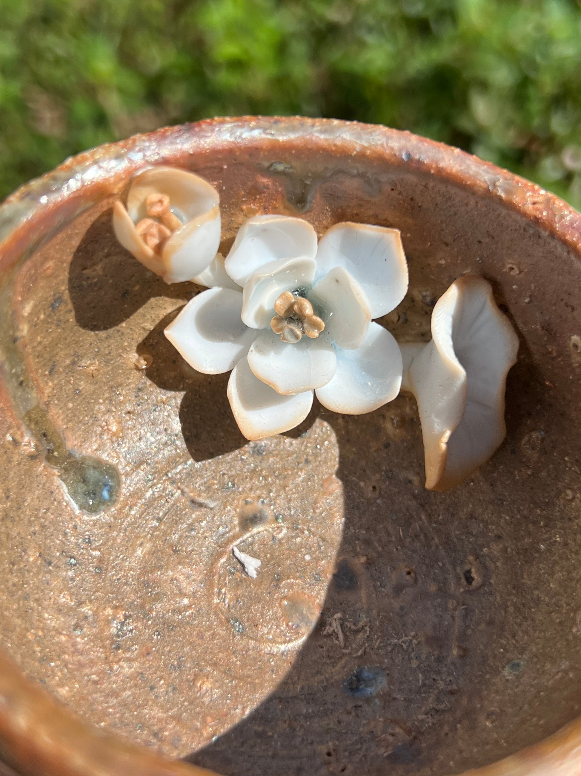 This is a woodfired pottery flower teacup