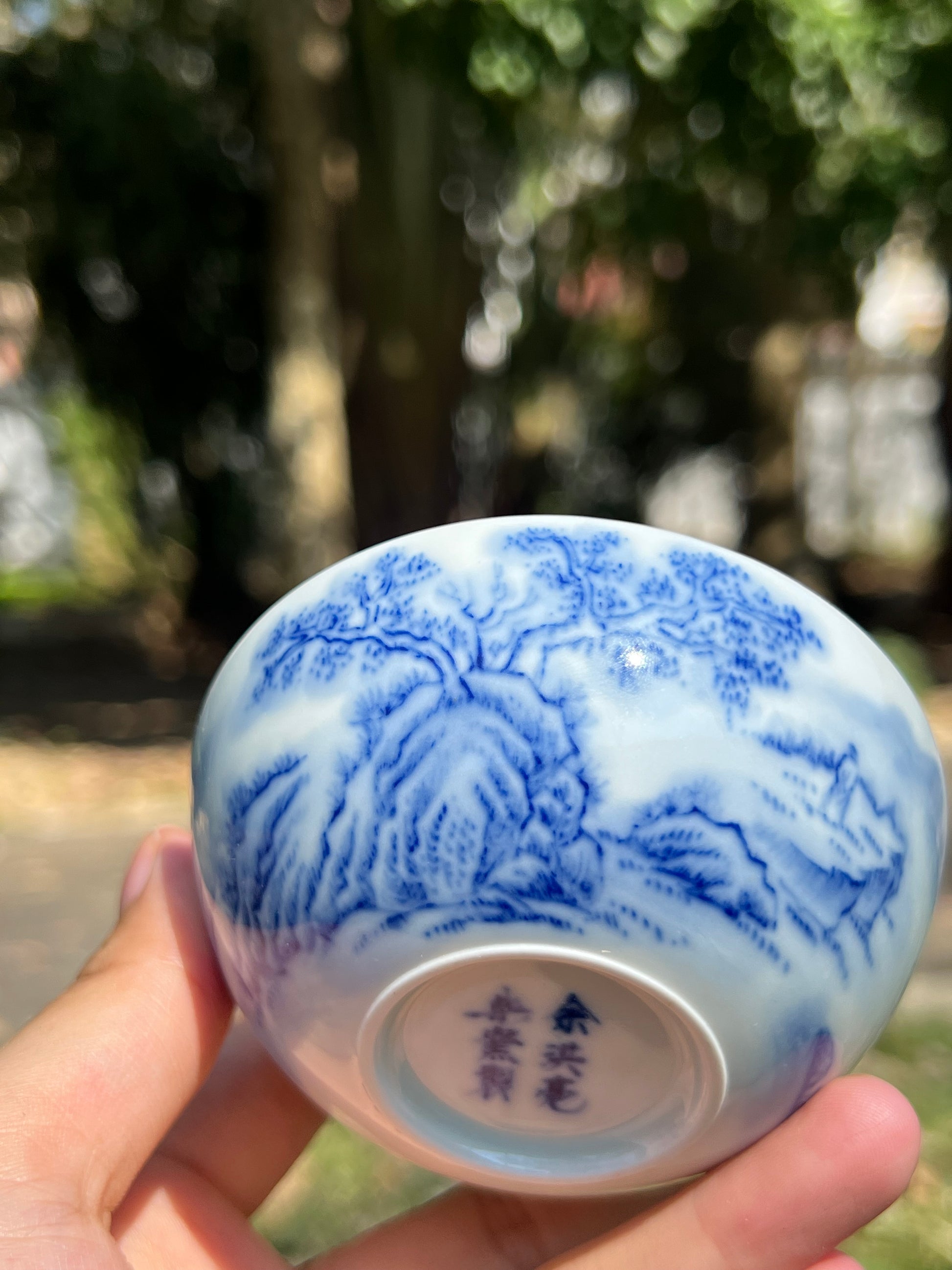 This is a Chinese Jingdezhen blue and white porcelain landscape teacup