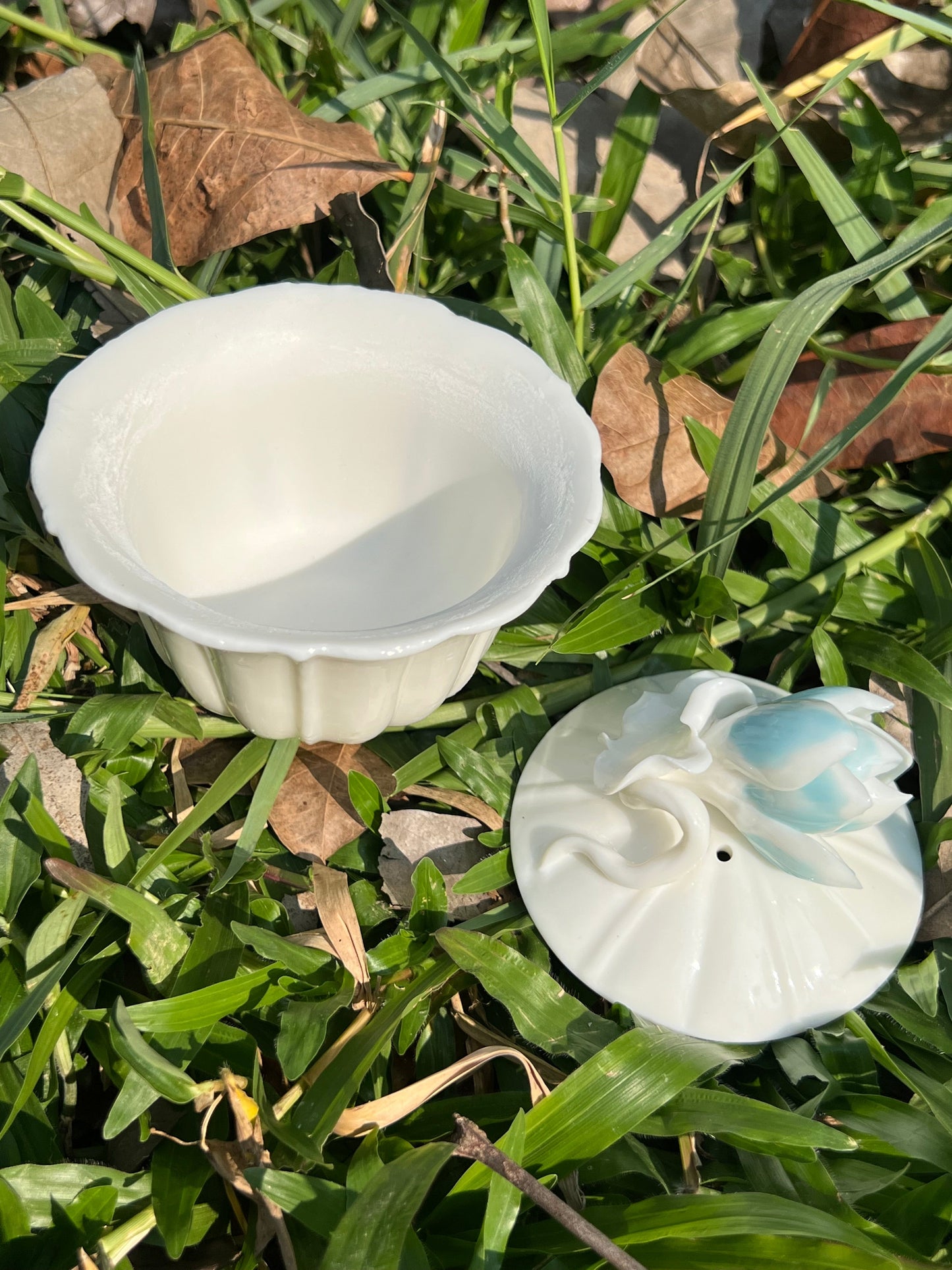 this is a woodfired white fine pottery flower teacup