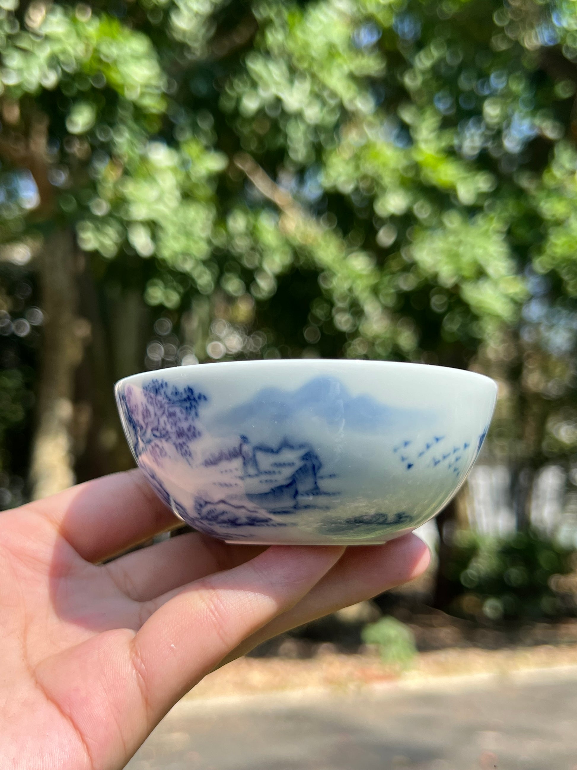 This is a Chinese Jingdezhen blue and white porcelain landscape teacup