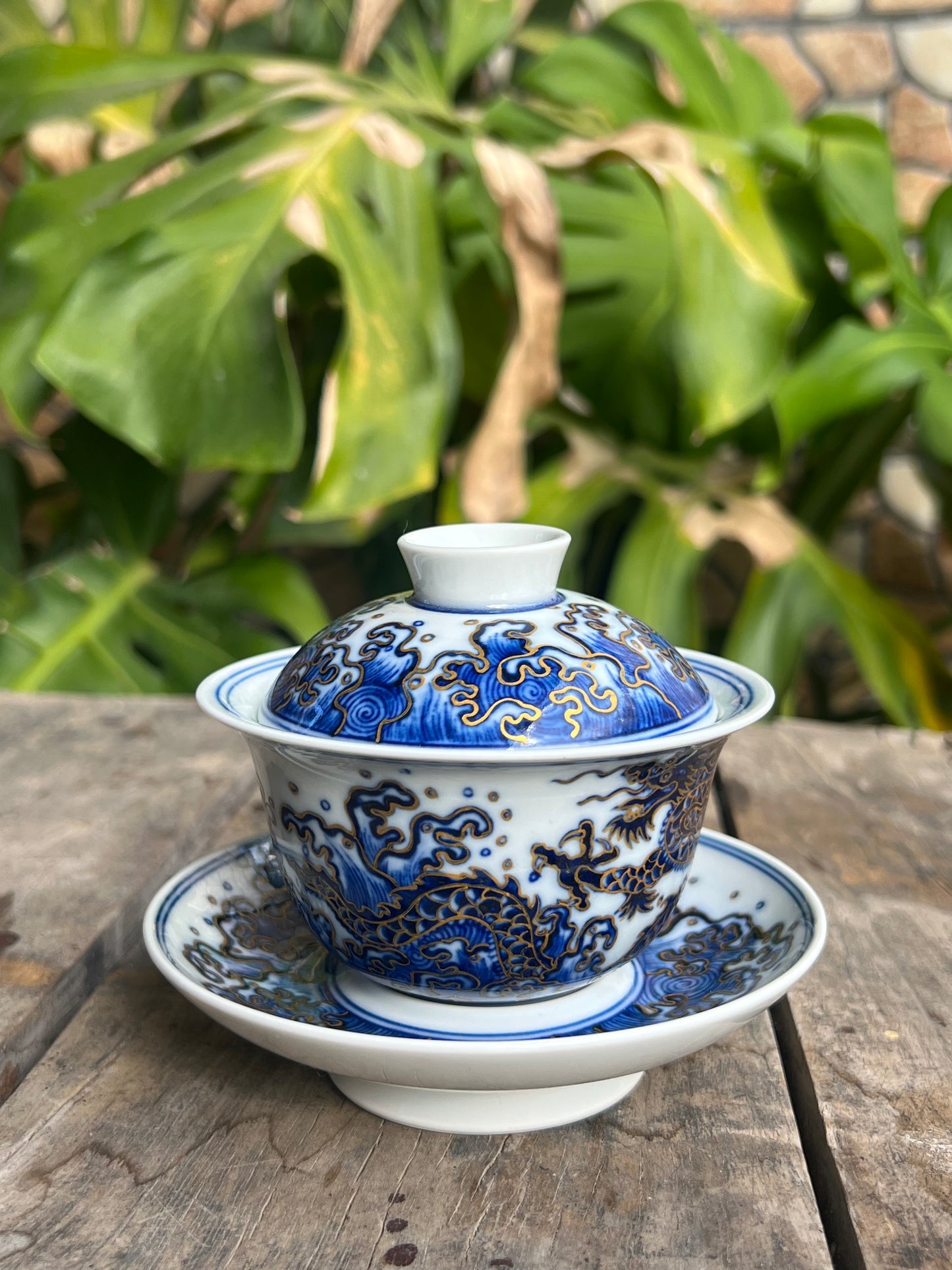 This is a Chinese Jingdezhen blue and white porcelain dragon teapot gaiwan