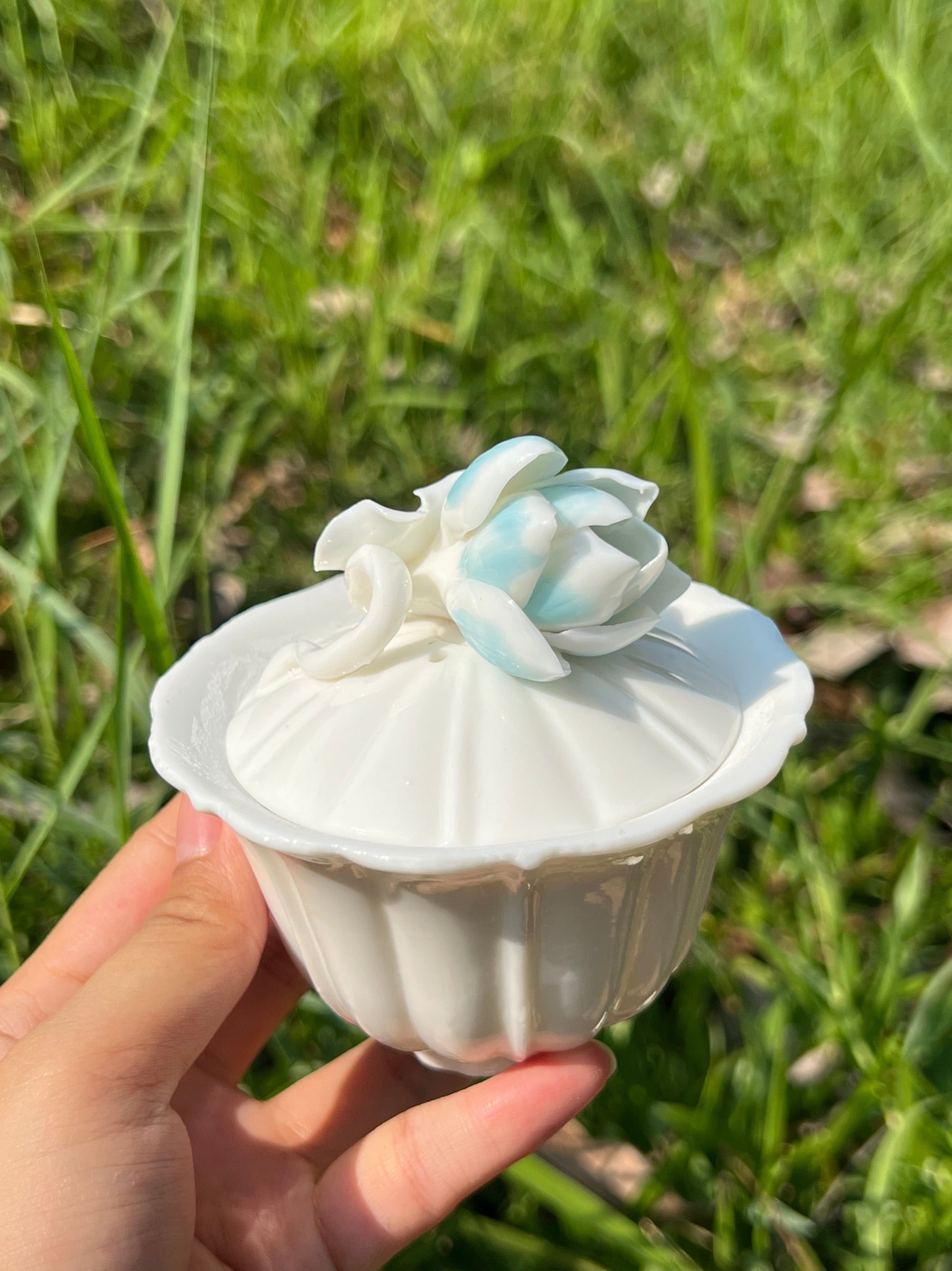 this is a woodfired white fine pottery flower teacup