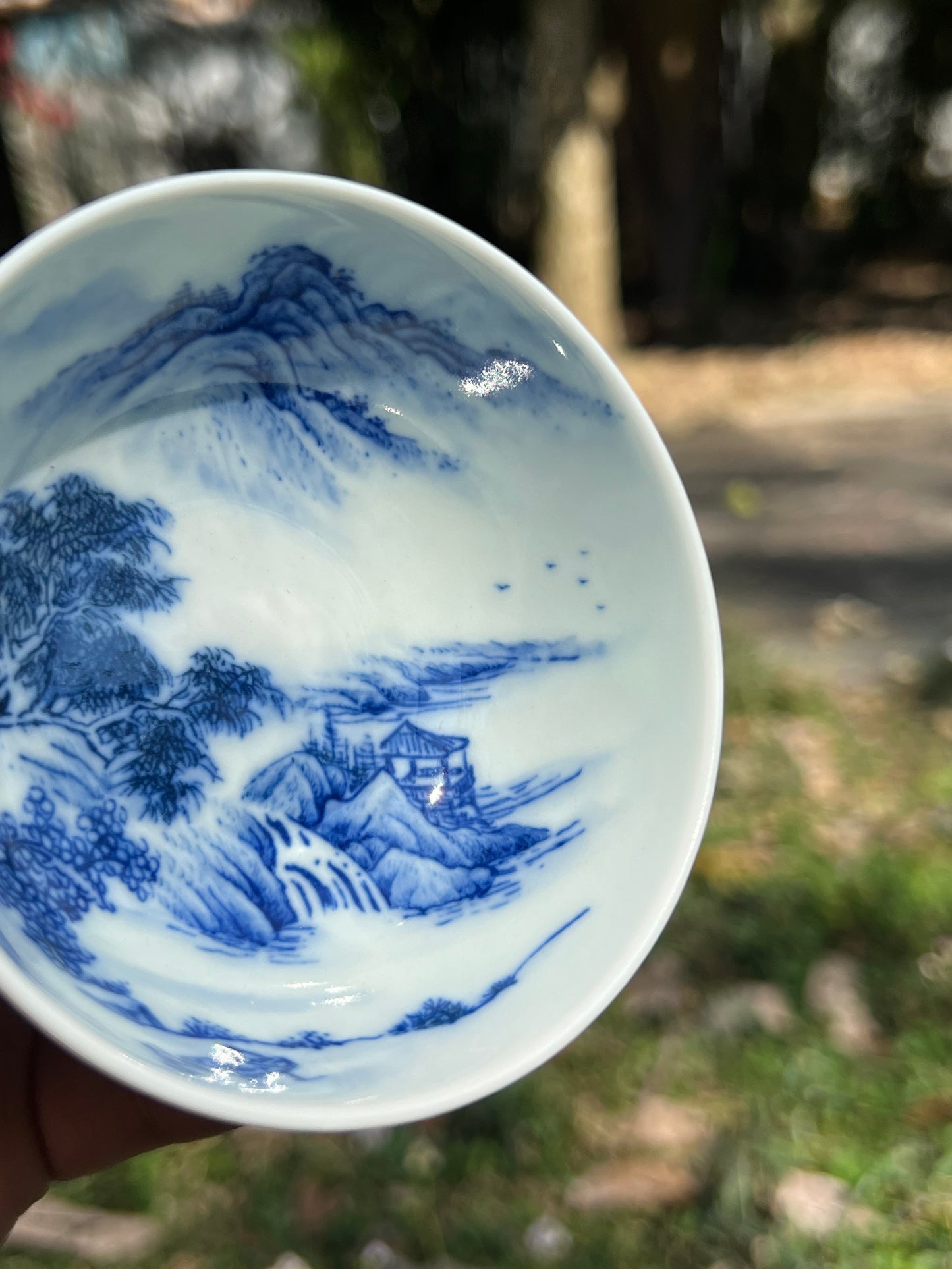 This is a Chinese Jingdezhen blue and white porcelain landscape teacup