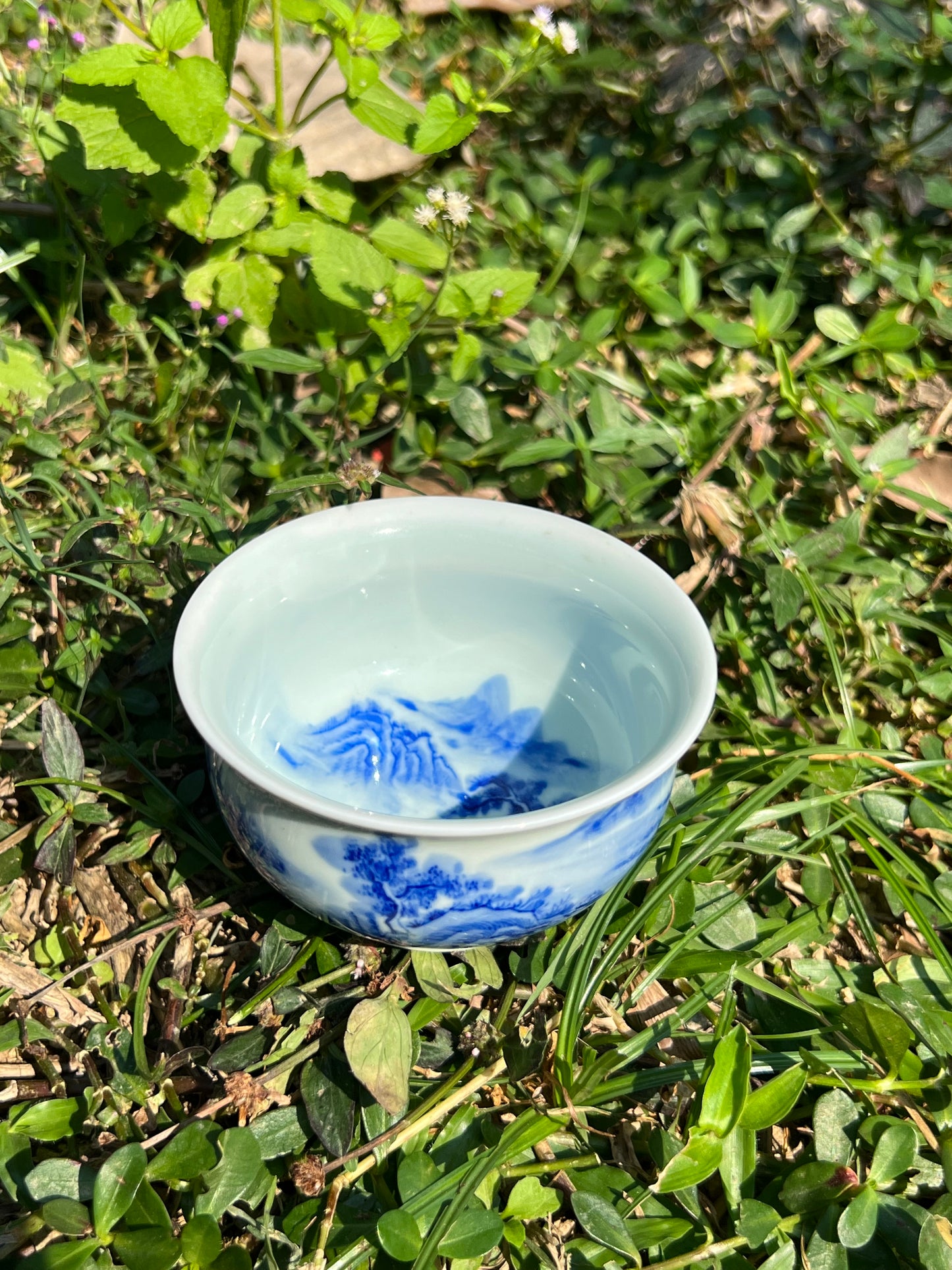 This is a Chinese Jingdezhen blue and white porcelain landscape teacup