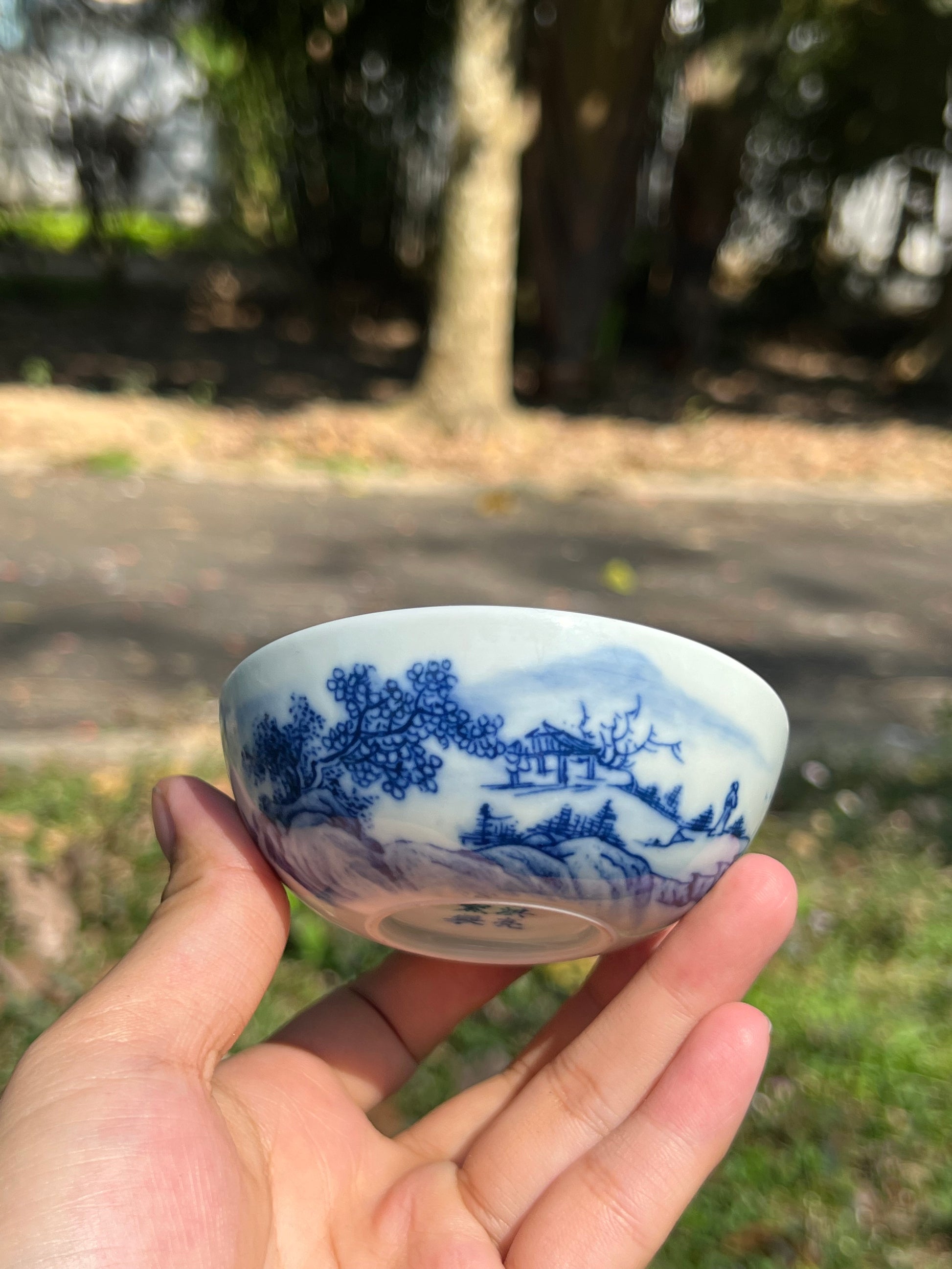 This is a Chinese Jingdezhen blue and white porcelain landscape teacup