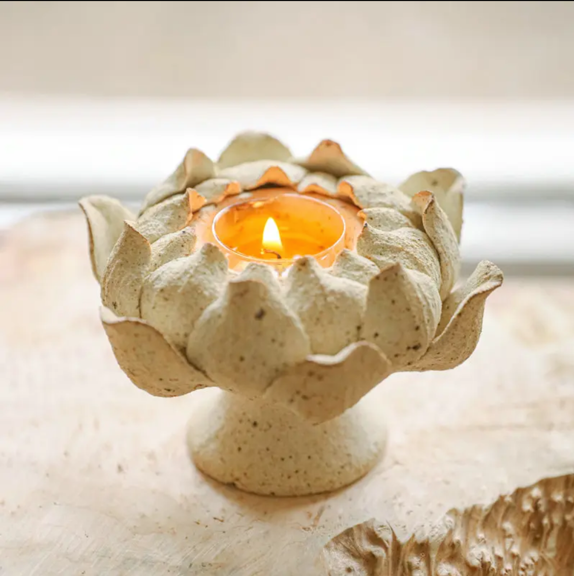 this is a pottery candlestick incense holder