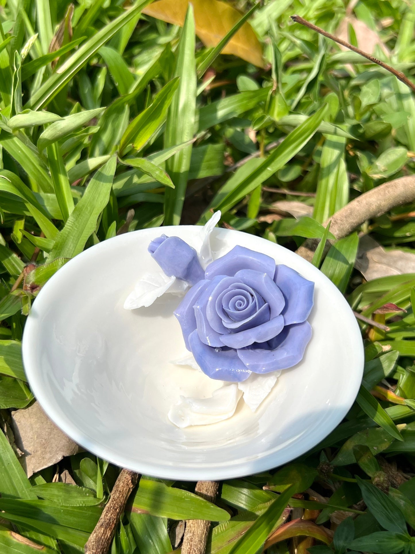 this is a woodfired white fine pottery flower teacup