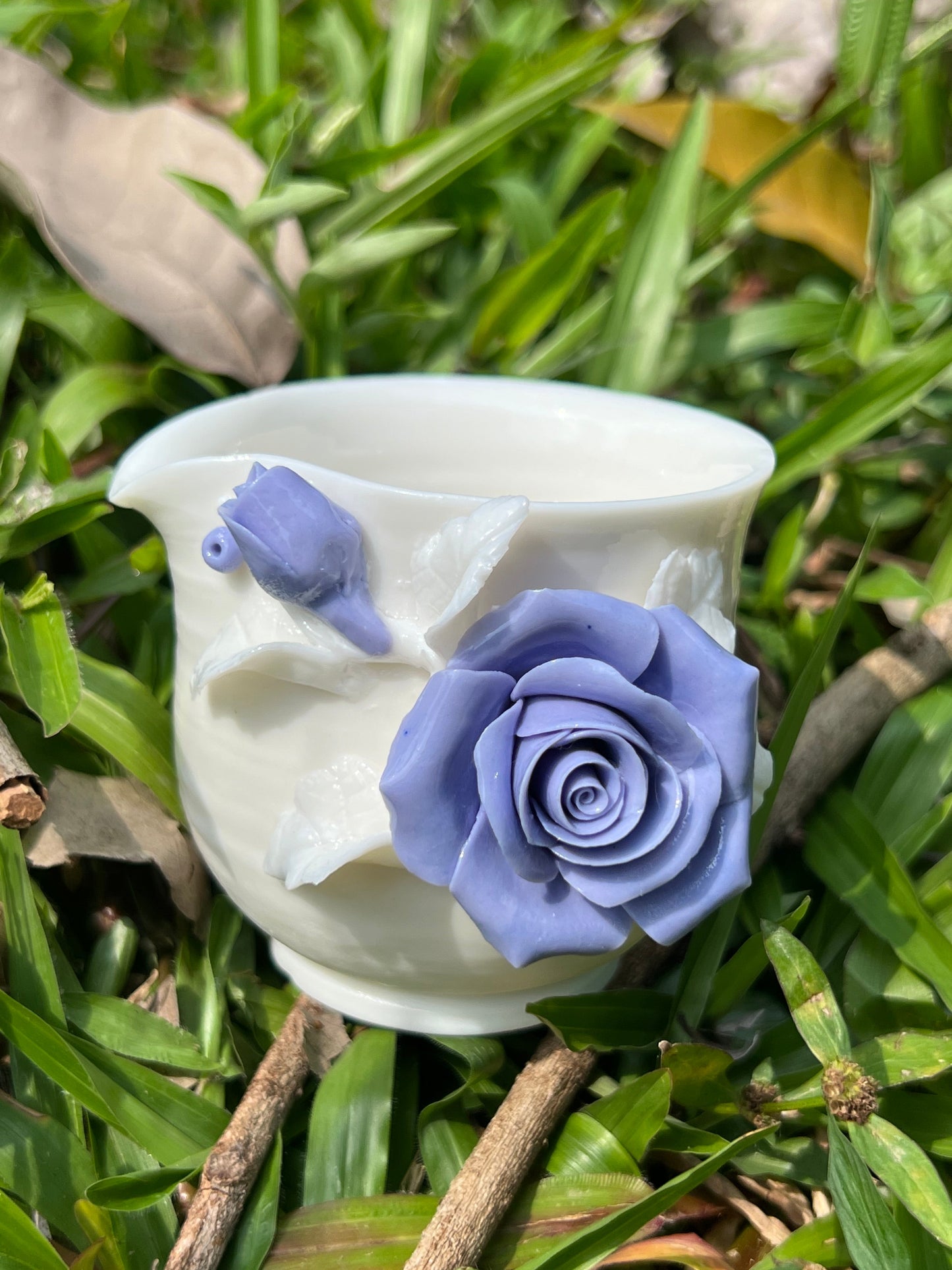 this is a woodfired white fine pottery flower teacup